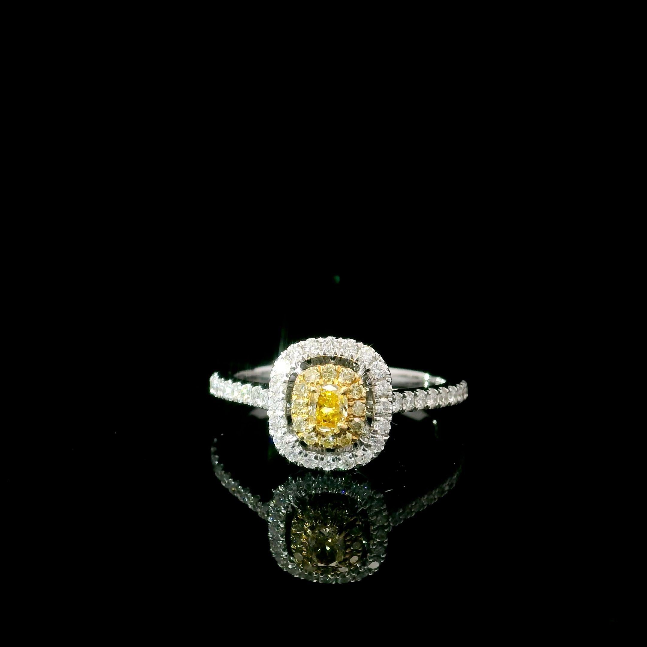 18kt white gold ring with diamonds

  Gold colour & karat: White gold 18kt
  Weight: 2.86 grams
  
  Set with-
  Stone type: Diamonds
  Shape: Oval
  Carat: 0.113 ct
  Colour: Fancy Intense Yellow
  Clarity: VS
  
  Surrounding Stones: Diamonds
 1)