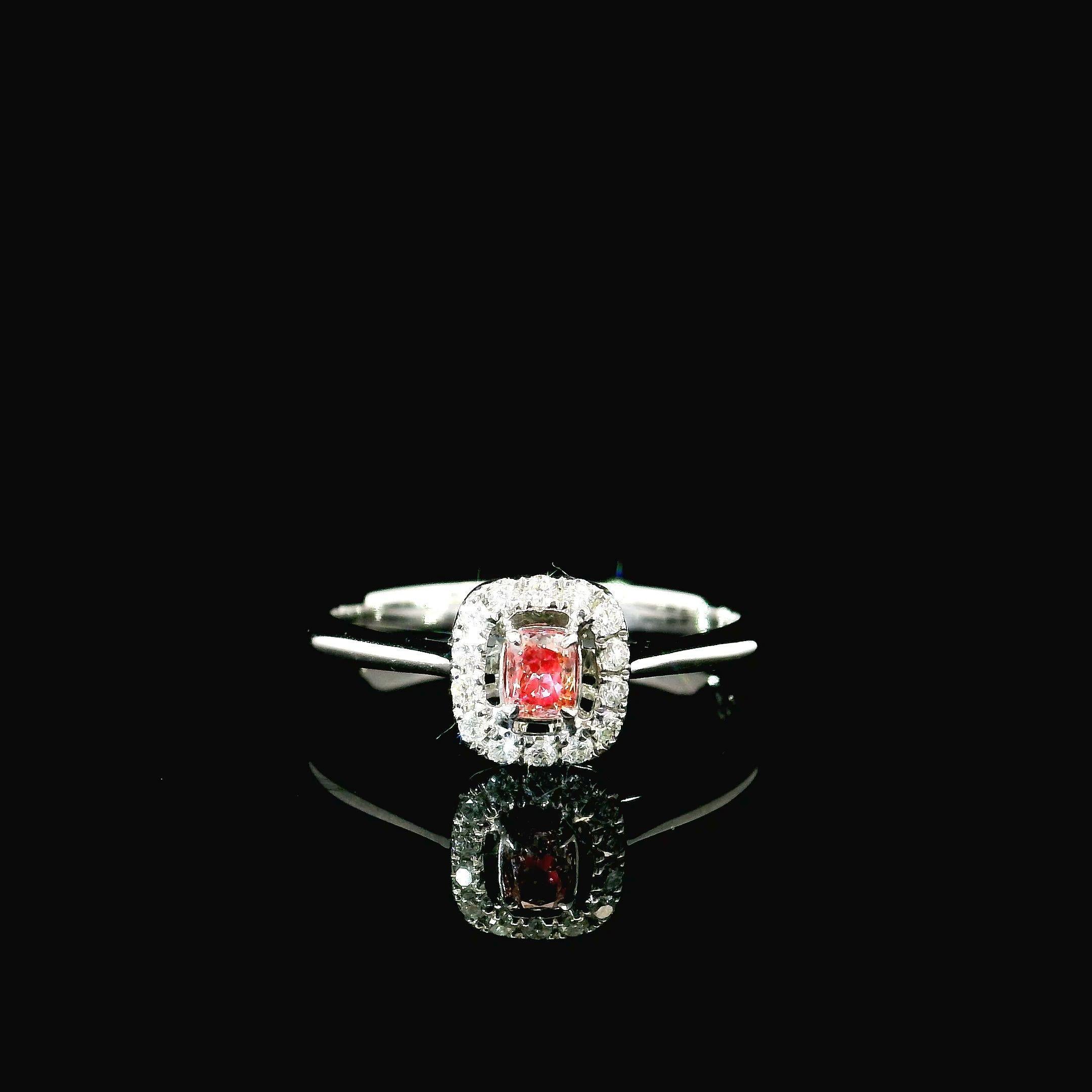 18kt white gold ring with diamonds
  
  Gold colour & karat: White gold 18kt
  Weight: 2.18 grams
  
  Set with-
  Stone type: Diamonds
  Shape: Cushion
  Carat: 2.18 ct
  Colour: Fancy Intense Pink
  Clarity: VS
  
  Surrounding Stones: Diamonds
