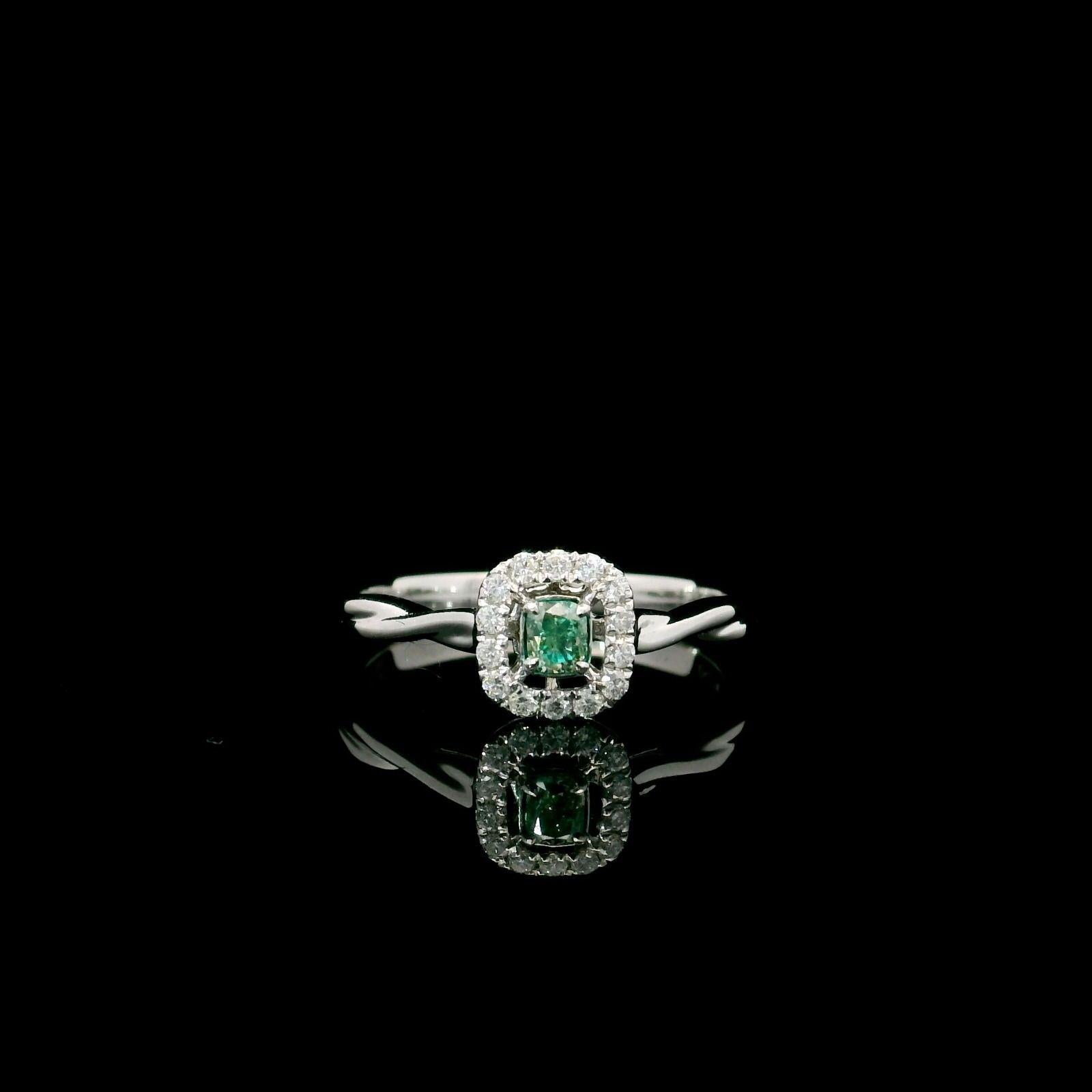 18kt white gold ring with diamonds
  
  Gold colour & karat: White gold 18kt
  Weight: 2.33 grams
  
  Set with-
  Stone type: Diamonds
  Shape: Cushion
  Carat: 0.13
  Colour: Fancy Green
  Clarity: VS
  
  Surrounding Stones: Diamonds
 1) White