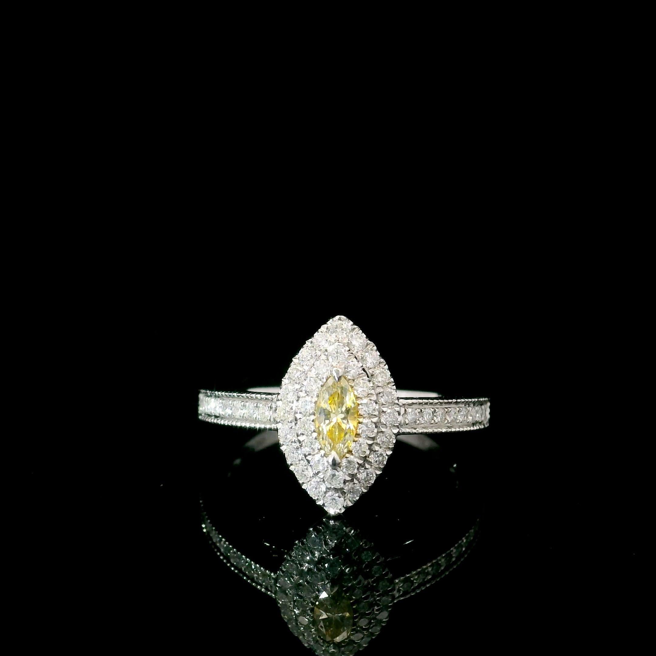 18kt white gold ring with diamonds

  Gold colour & karat: White gold 18kt
  Weight: 2.91 grams
  
  Set with-
  Stone type: Diamonds
  Shape: Marquise
  Carat: 0.136 ct
  Colour: Fancy Yellow
  Clarity: VS
  
  Surrounding Stones: Diamonds
 1)