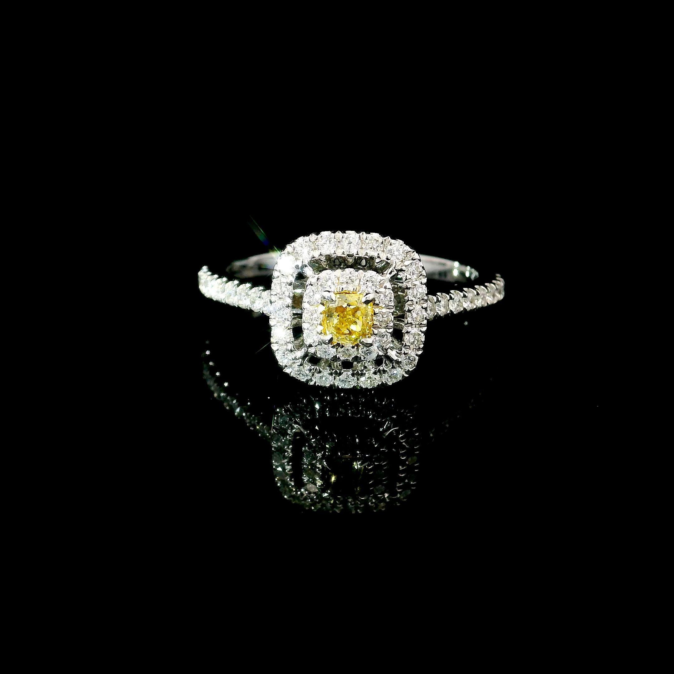 18kt white gold ring with diamonds
  
  Gold colour & karat: White gold 18kt
  Weight: 2.68 grams
  
  Set with-
  Stone type: Diamonds
  Shape: Pear
  Carat: 0.141 ct
  Colour: Fancy Yellow
  Clarity: VS
  
  Surrounding Stones: Diamonds
 1) White
