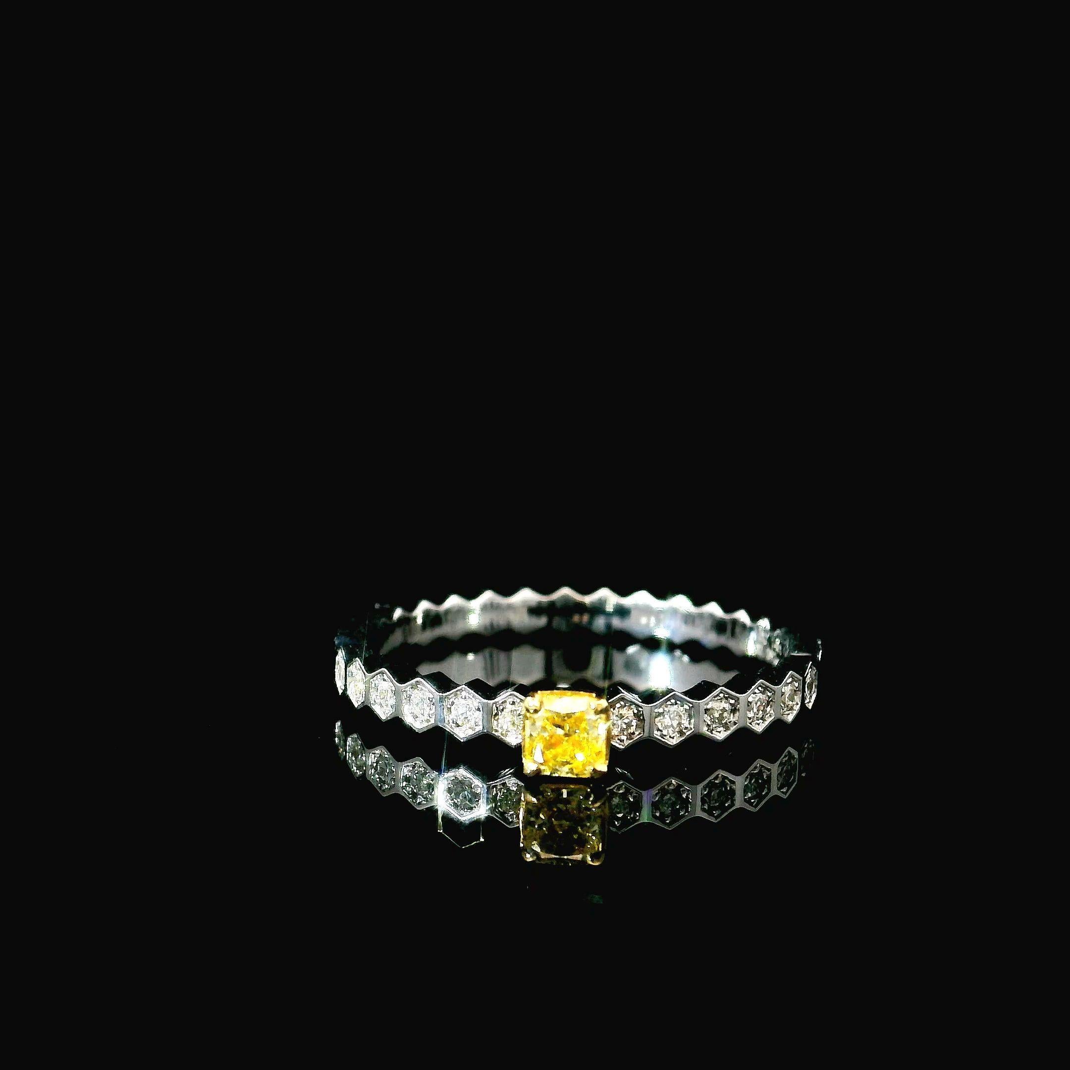 18kt white gold ring with diamonds

  Gold colour & karat: White gold 18kt
  Weight: 1.87 grams
  
  Set with-
  Stone type: Diamonds
  Shape: Cushion
  Carat: 0.142 ct
  Colour: Fancy Yellow
  Clarity: SI1
  
  Surrounding Stones: Diamonds
 1)