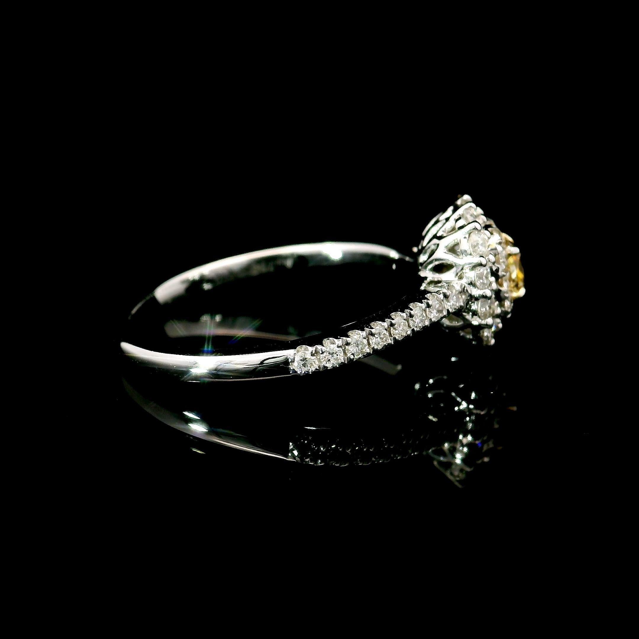 18kt white gold ring with diamonds
  
  Gold colour & karat: White gold 18kt
  Weight: 2.59 grams
  
  Set with-
  Stone type: Diamonds
  Shape: Cushion
  Carat: 0.149 ct
  Colour: Fancy Yellow
  Clarity: VS
  
  Surrounding Stones: Diamonds
 1)