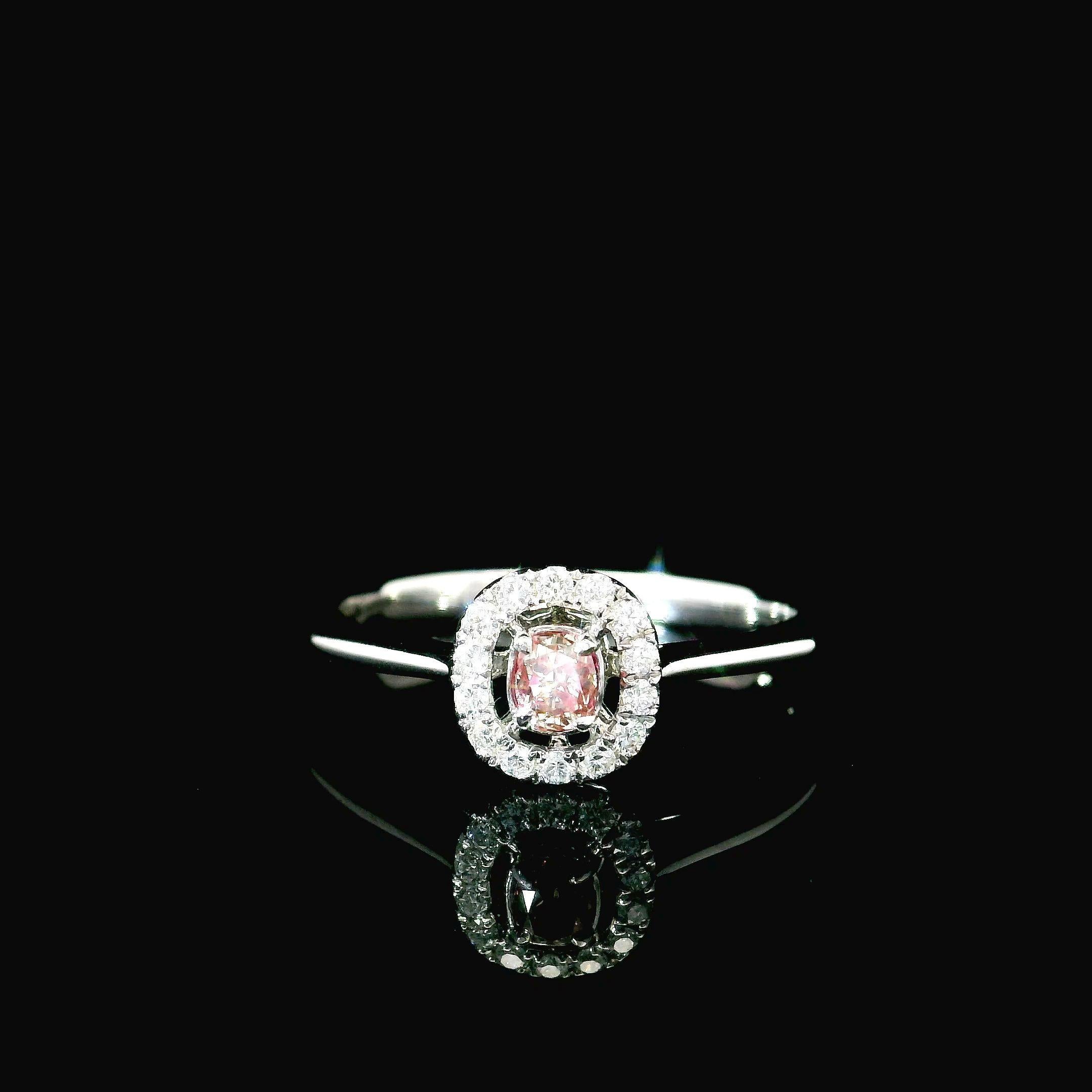 18kt white gold ring with diamonds
  
  Gold colour & karat: White gold 18kt
  Weight: 2.07 grams
  
  Set with-
  Stone type: Diamonds
  Shape: Cushion
  Carat: 1.56 ct
  Colour: Fancy Intense Pink
  Clarity: VS
  
 Surrounding Stones: Diamonds
 1)