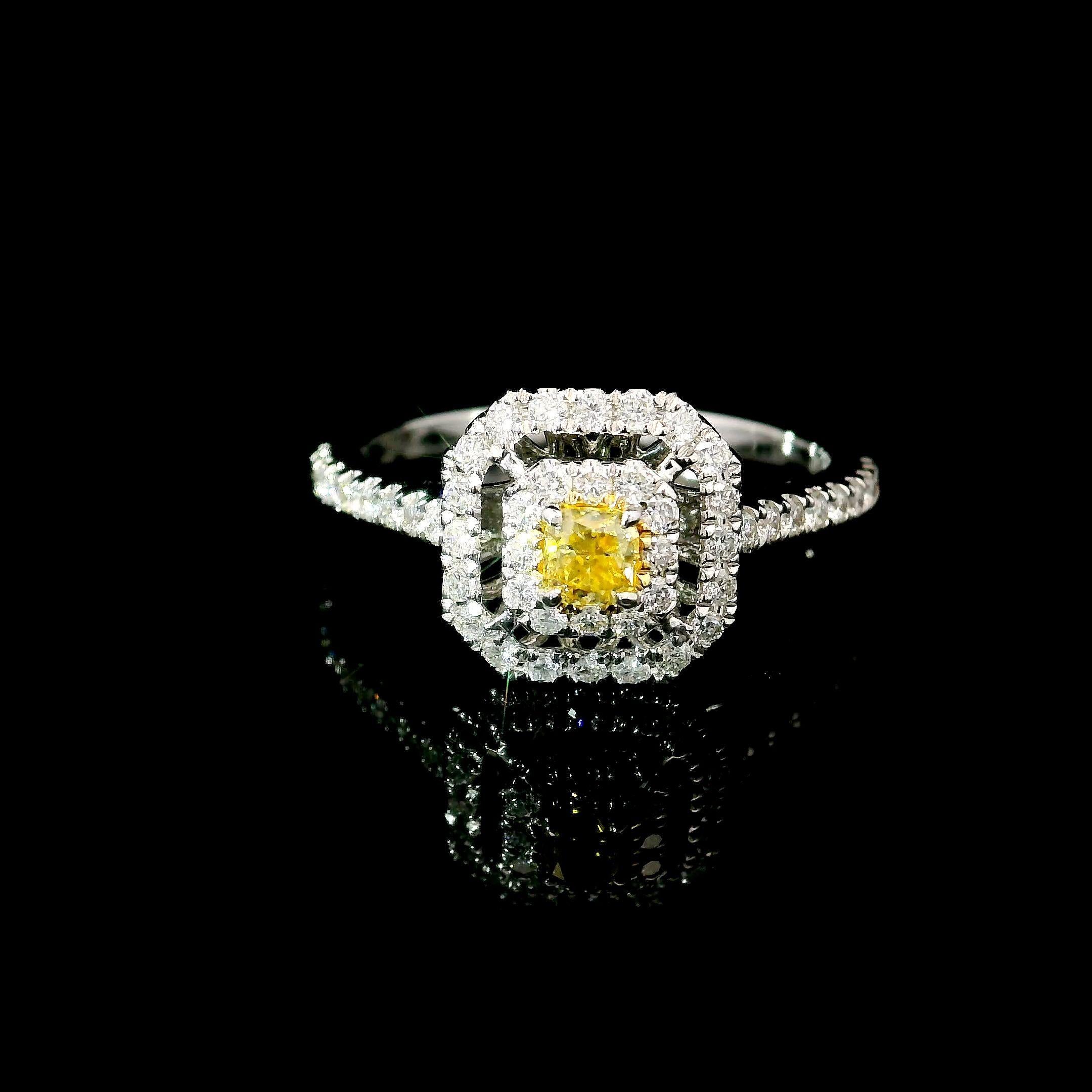 18kt white gold ring with diamonds
  
Gold colour & karat: White gold 18kt
Weight: 2.81 grams
  
Set with-
  Stone type: Diamonds
  Shape: Radiant
  Carat: 0.16 ct
  Colour: Fancy Yellow
  Clarity: VS
  
  Surrounding Stones: Diamonds
 1) White