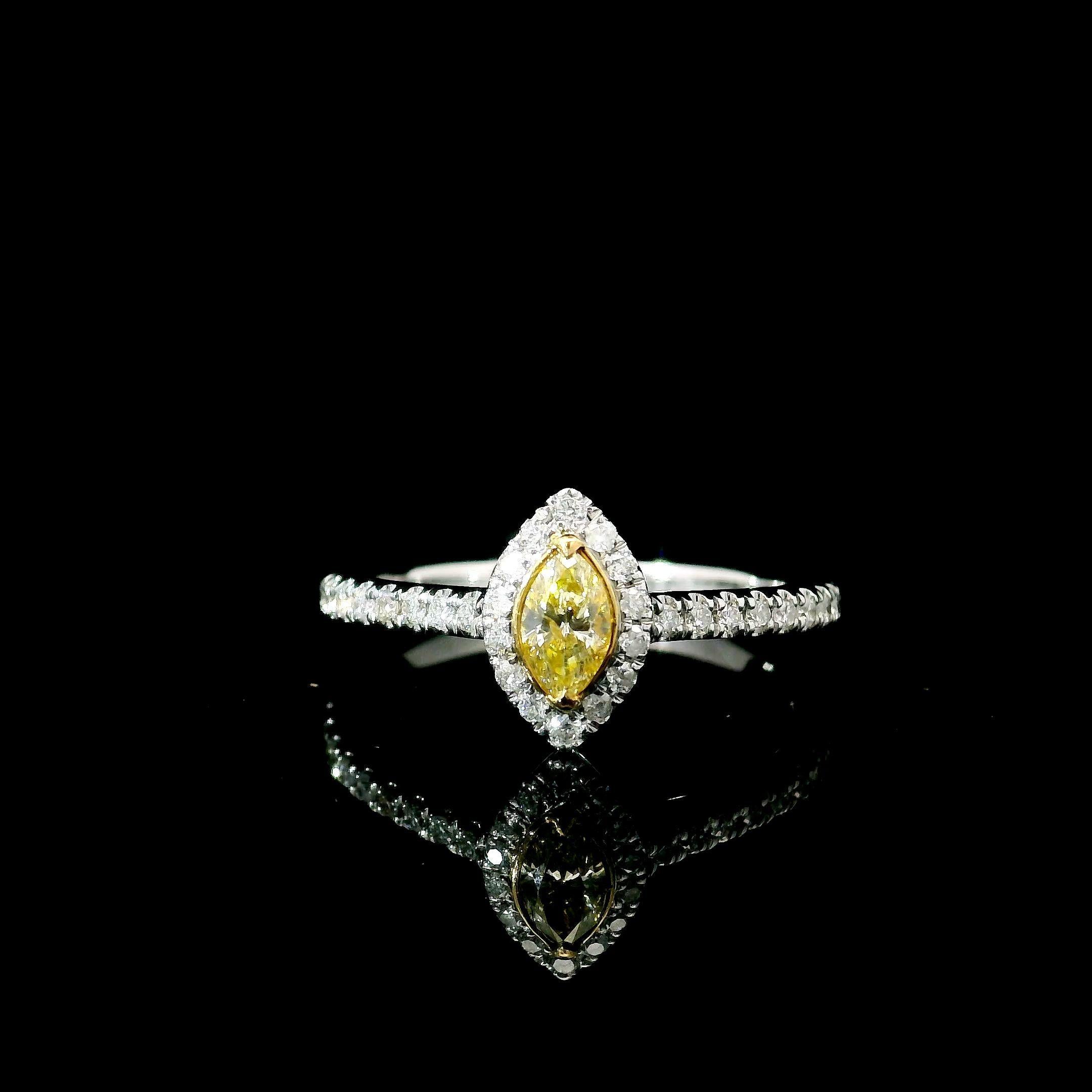 18kt white gold ring with diamonds
  
  Gold colour & karat: White gold 18kt
  Weight: 2.31 grams
  
  Set with-
  Stone type: Diamonds
  Shape: Marquise
  Carat: 0.168 ct
  Colour: Fancy Yellow
  Clarity: SI
  
  Surrounding Stones: Diamonds
 1)