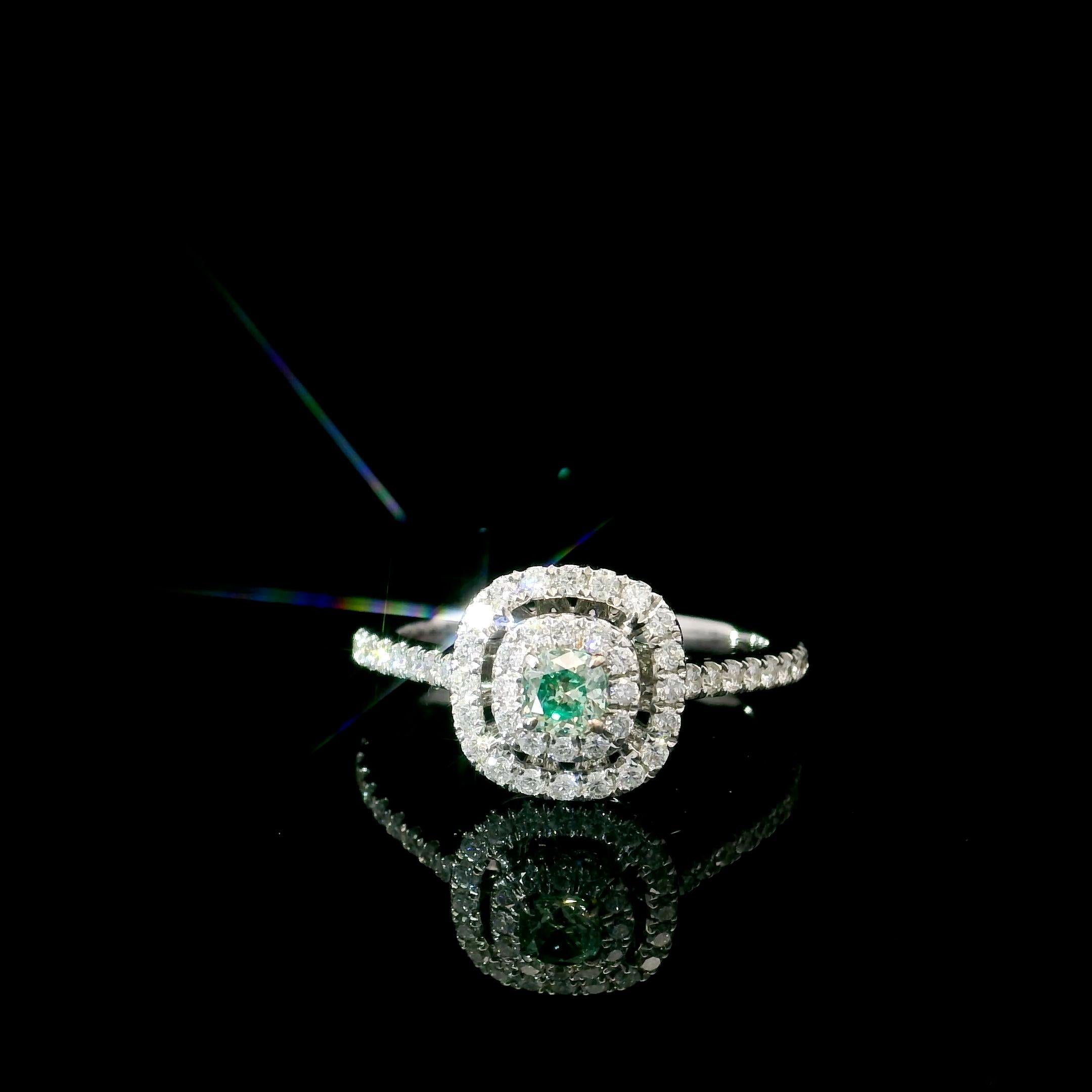 18kt white gold ring with diamonds
  
  Gold colour & karat: White gold 18kt
  Weight: 2.83 grams
  
  Set with-
  Stone type: Diamonds
  Shape: Cushion
  Carat: 0.182 ct
  Colour: Fancy Intense Green
  Clarity: VS
  
  Surrounding Stones: Diamonds
