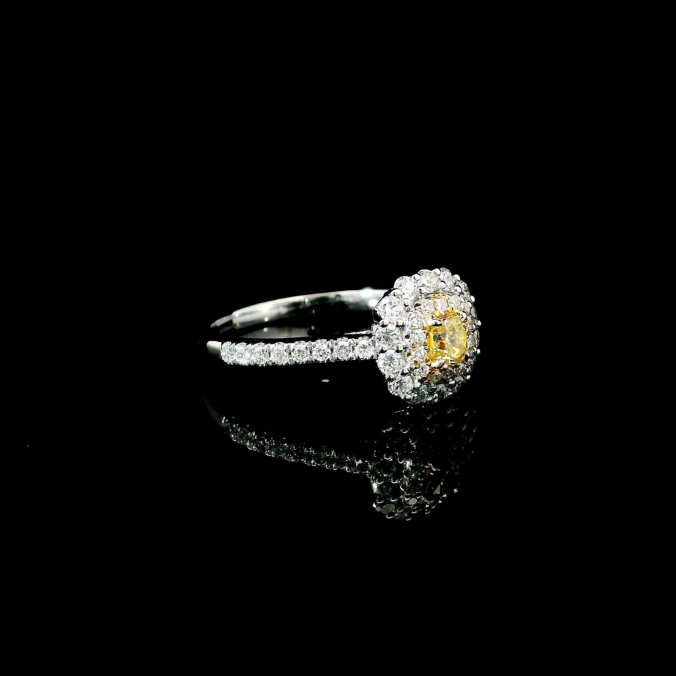 18kt white gold ring with diamonds
  
  Gold colour & karat: White gold 18kt
  Weight: 2.63 grams
  
  Set with-
  Stone type: Diamonds
  Shape: Cushion
  Carat: 0.184 ct
  Colour: Fancy Yellow
  Clarity: VS
  
  Surrounding Stones: Diamonds
 1)