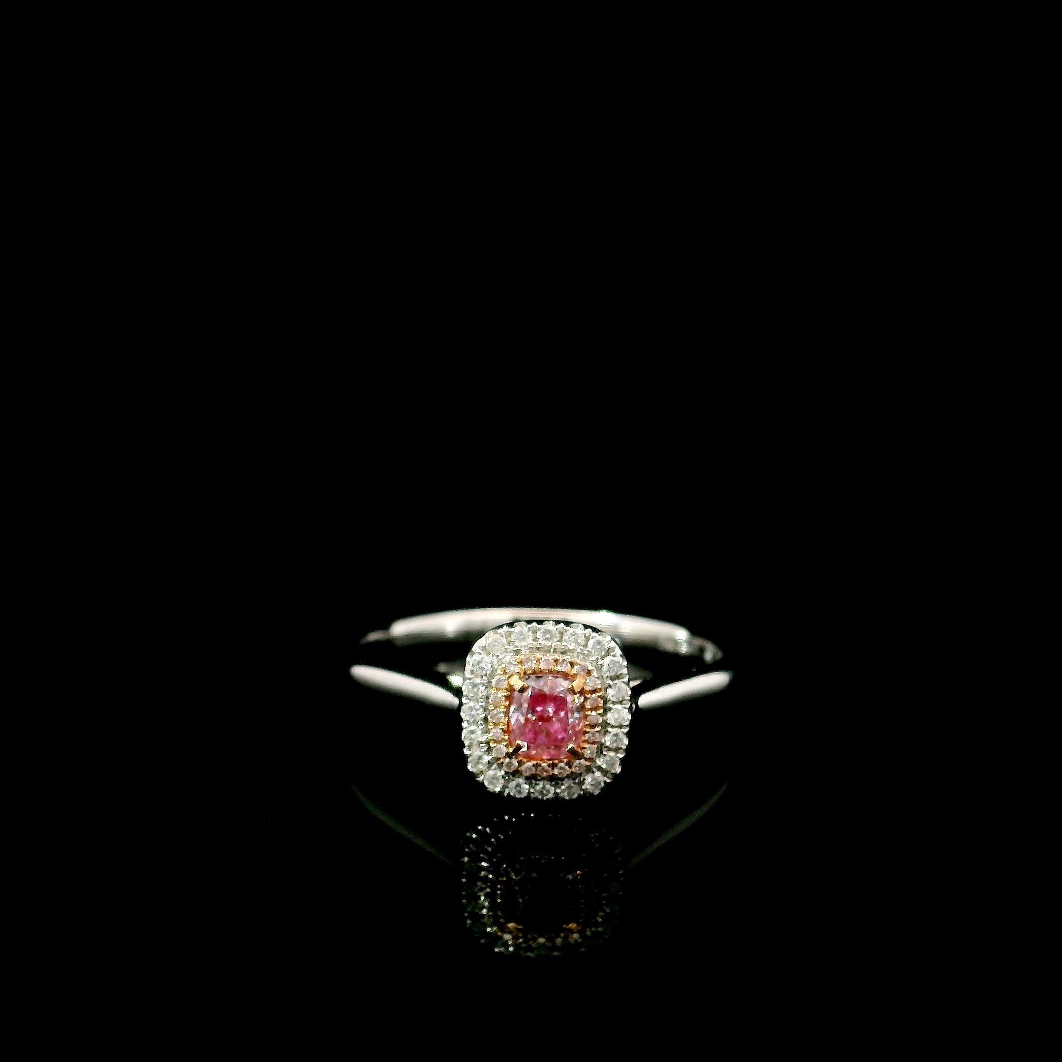 18kt white gold ring with diamonds
  
  Gold colour & karat: White gold 18kt
  Weight: 2.420 grams
  
  Set with-
  Stone type: Diamonds
  Shape: Oval
  Carat: 0.19 ct
  Colour: Fancy Pink
  Clarity: VS
  
  Surrounding Stones: Diamonds
 1) White