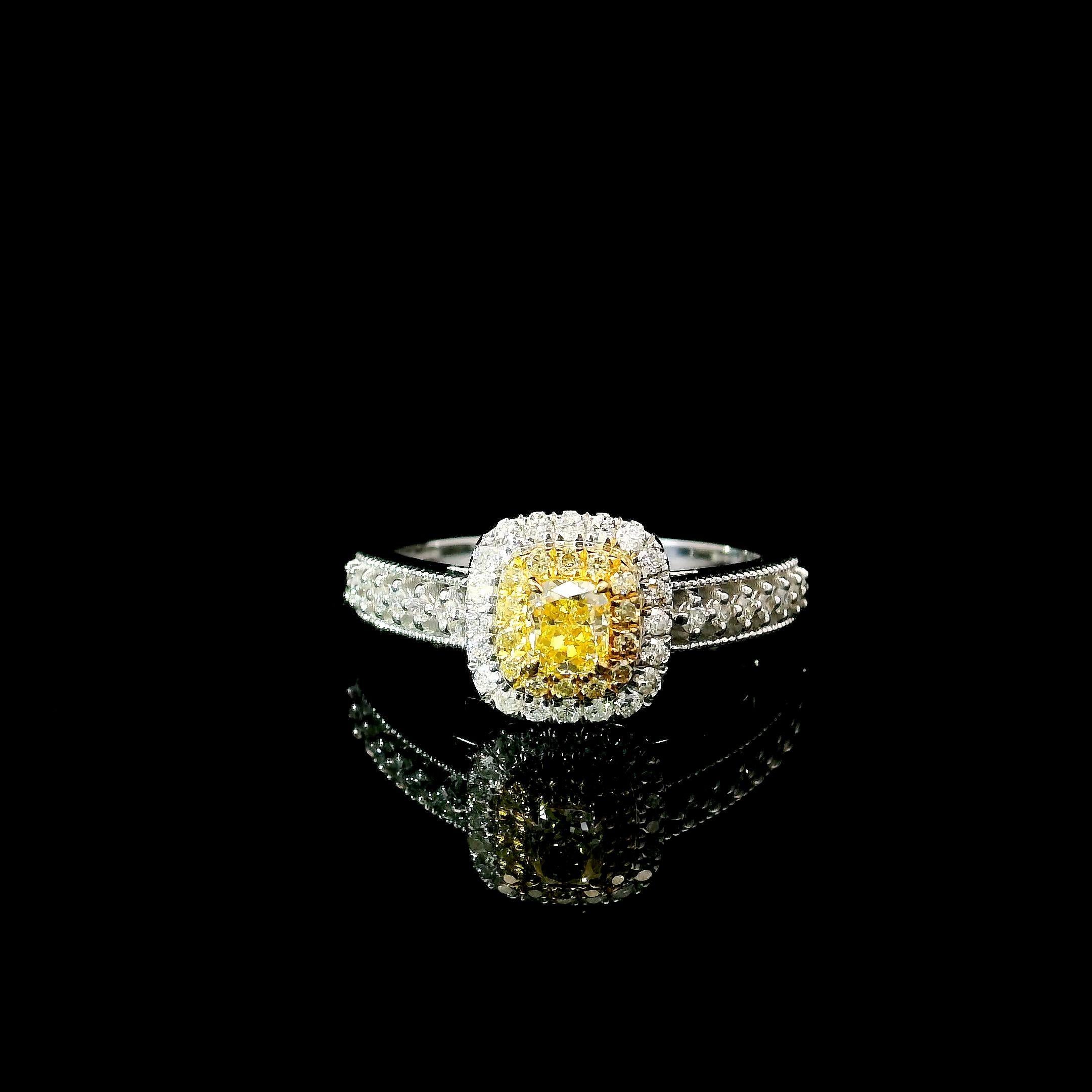 18kt white gold ring with diamonds
  
  Gold colour & karat: White gold 18kt
  Weight: 3.17 grams
  
  Set with-
  Stone type: Diamonds
  Shape: Cushion
  Carat: 0.235 ct
  Colour: Fancy Intense Yellow
  Clarity: VS
  
  Surrounding Stones: