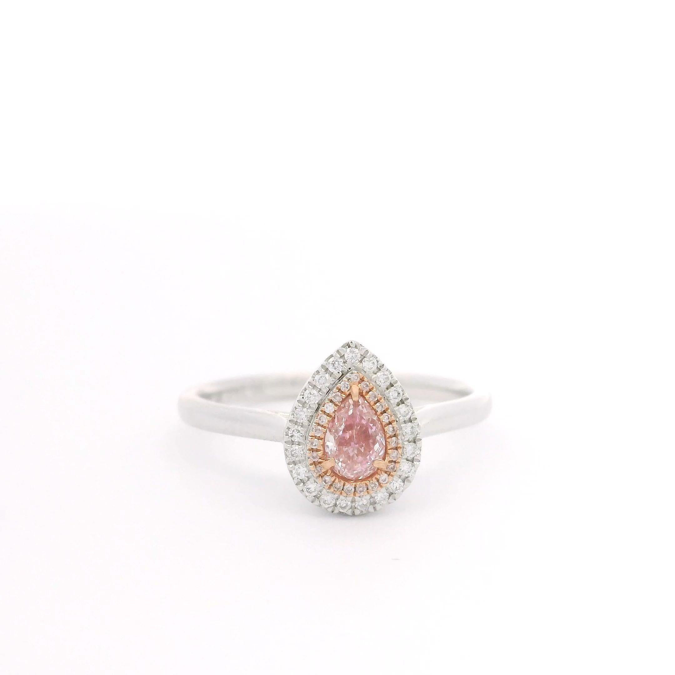 18kt white gold ring with diamonds
  
  Gold colour & karat: White gold 18kt
  Weight: 2.515 grams
  
  Set with-
  Stone type: Diamonds
  Shape: Pear
  Carat: 0.24
  Colour: Fancy Pink 
  Clarity: VS
  
  Surrounding Stones: Diamonds
 1) White