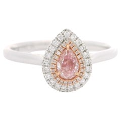 Anillo de diamantes con certificado AGL de 0.24 quilates de color rosa fantasía y claridad VS