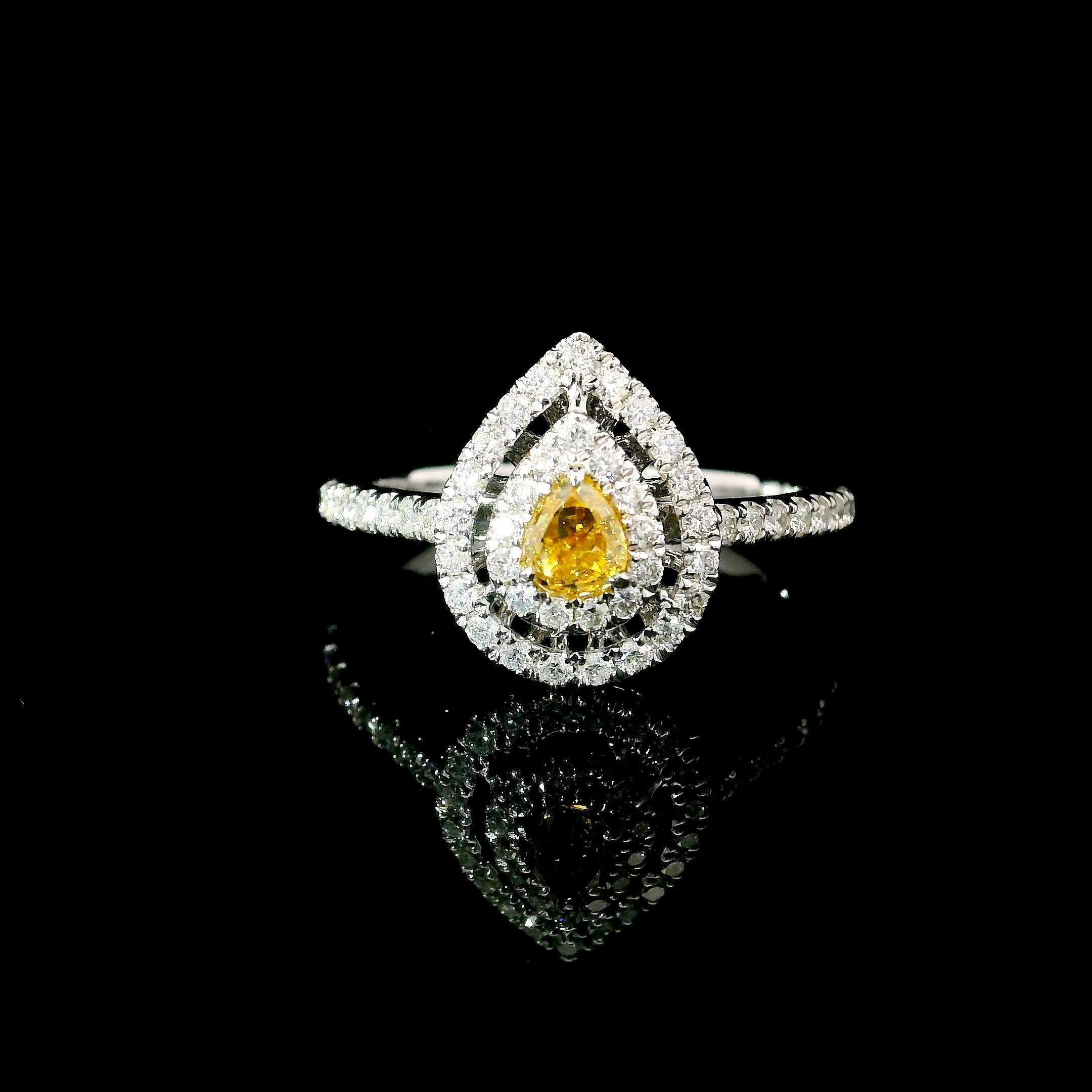 18kt white gold ring with diamonds

  Gold colour & karat: White gold 18kt
  Weight: 2.85 grams
  
  Set with-
  Stone type: Diamonds
  Shape: Pear
  Carat: 0.243 ct
  Colour: Fancy Intense Yellow
  Clarity: VS
  
  Surrounding Stones: Diamonds
 1)
