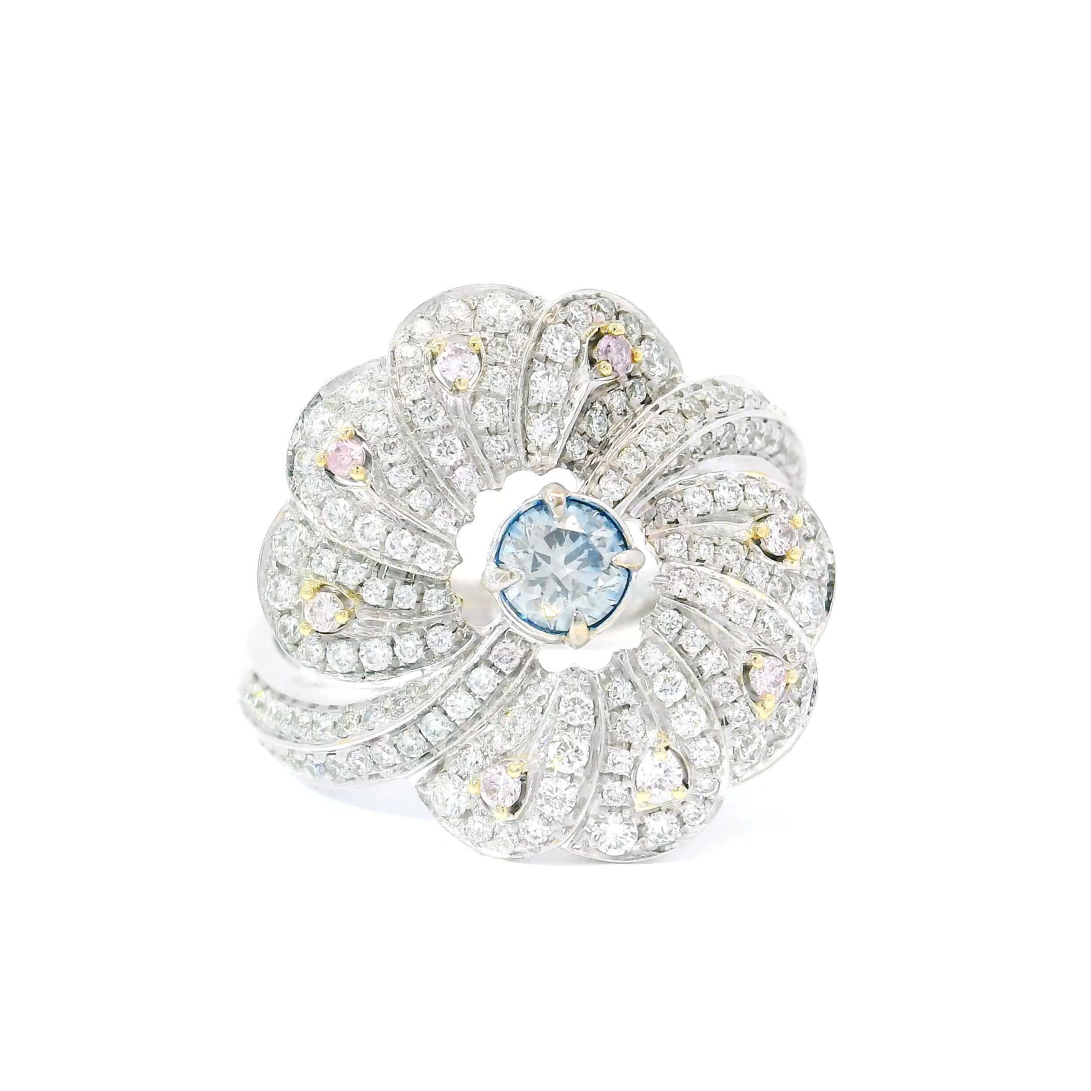  18kt white gold ring with diamonds
  
  Gold colour & karat: White gold 18kt
  Weight: 6.303 grams
  
  Set with-
  Stone type: Diamonds
  Shape: Round
  Carat: 0.25 ct
  Colour: Fancy Blue
  Clarity: SI
  
  Surrounding Stones: Diamonds
 1) White