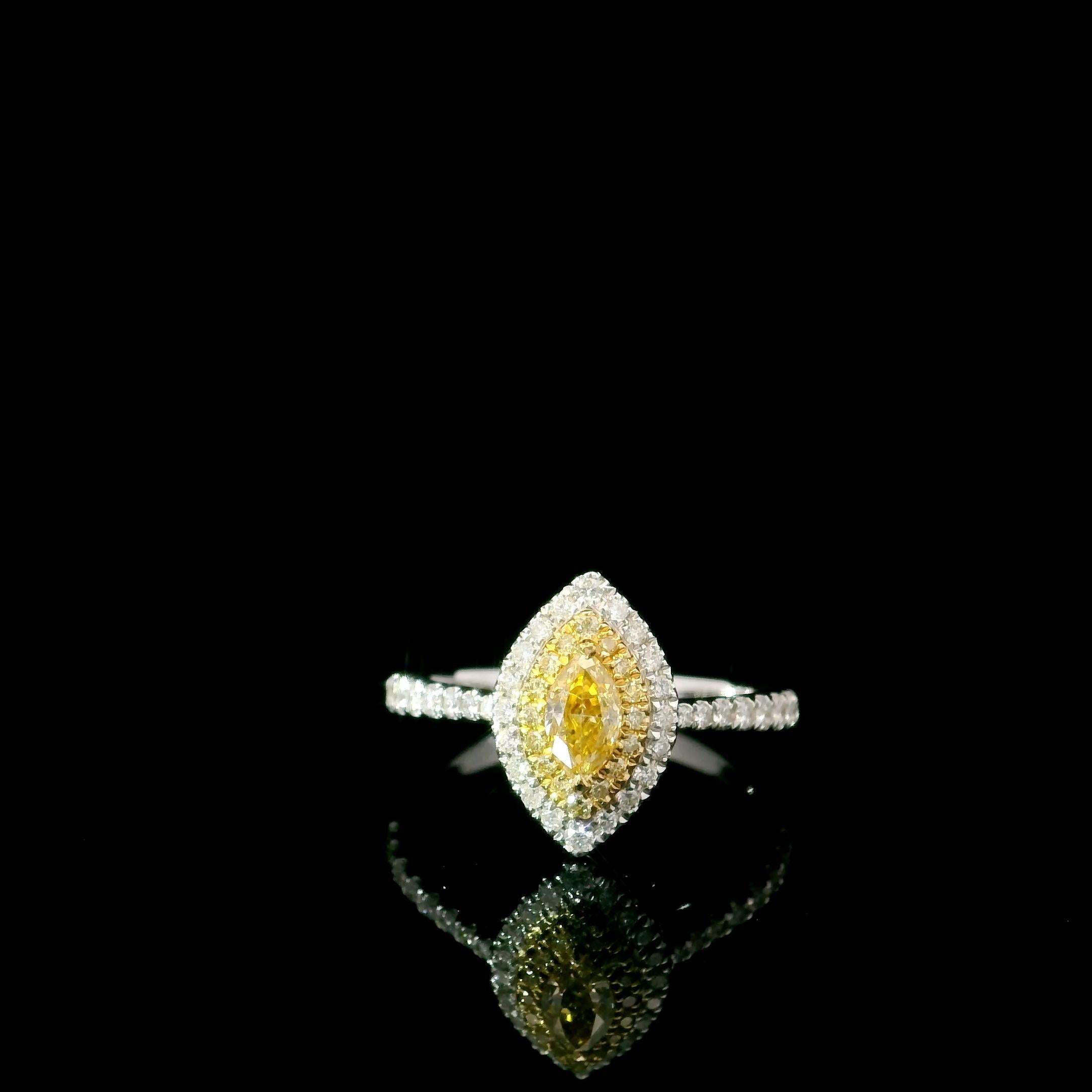 18kt white gold ring with diamonds
  
  Gold colour & karat: White gold 18kt
  Weight: 2.82 grams
  
  Set with-
  Stone type: Diamonds
  Shape: Marquise
  Carat: 0.251 ct
  Colour: Fancy Intense Yellow
  Clarity: VS
  
  Surrounding Stones: