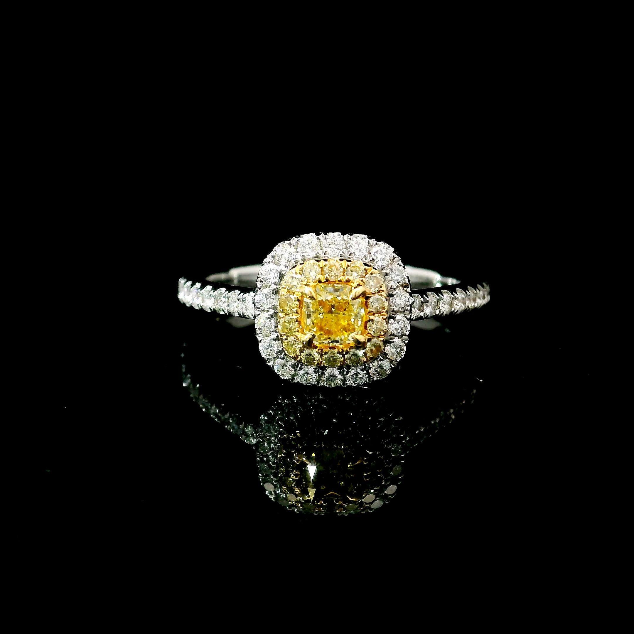 18kt white gold ring with diamonds
  
  Gold colour & karat: White gold 18kt
  Weight: 2.71 grams
  
  Set with-
  Stone type: Diamonds
  Shape: Cushion
  Carat: 0.269 ct
  Colour: Fancy Yellow
  Clarity: SI
  
  Surrounding Stones: Diamonds
 1)