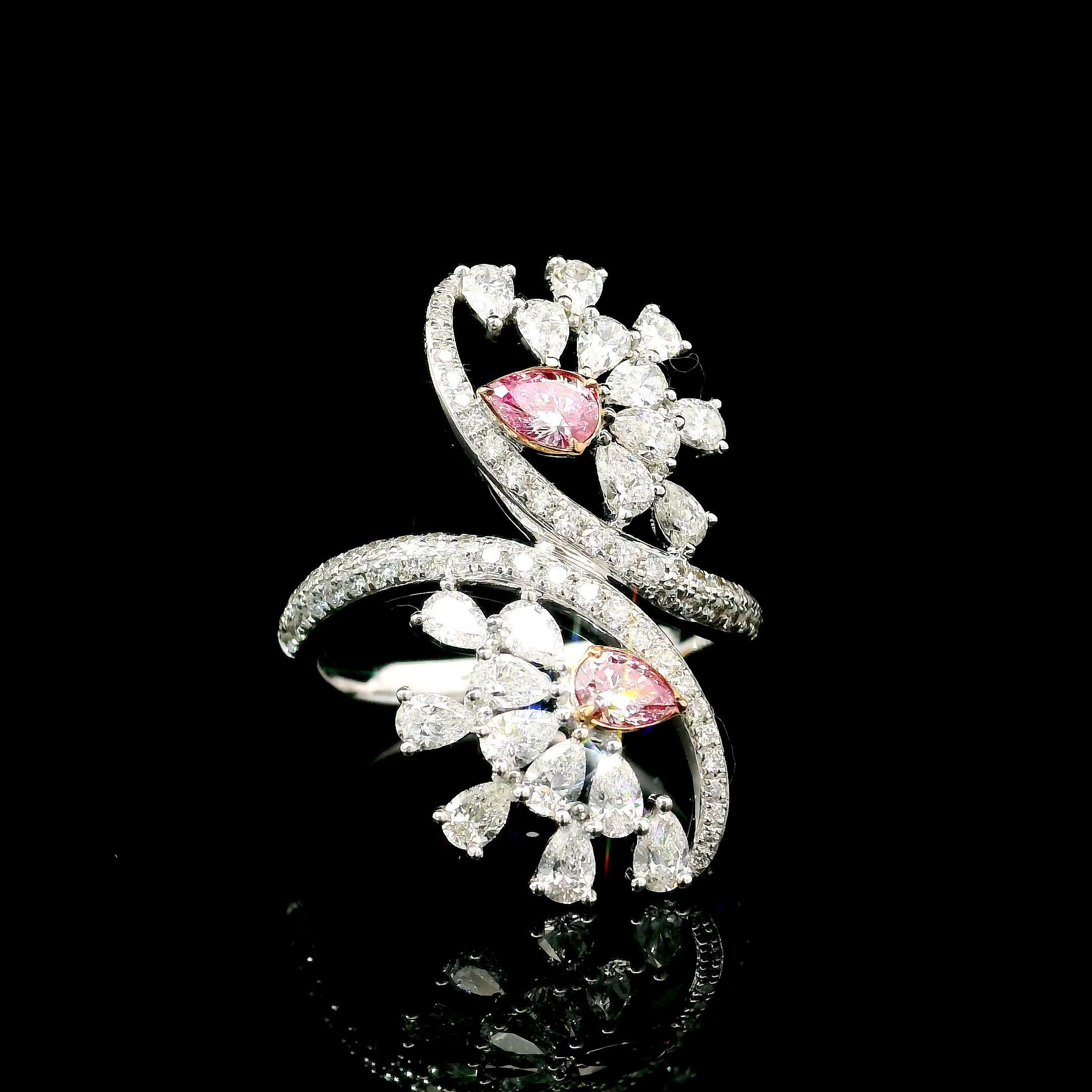 18kt white gold ring with diamonds
  
  Gold colour & karat: White gold 18kt
  Weight: 5.468 grams
  
  Set with-
  Stone type: Diamonds
  Shape: Pear
  Carat: 0.29
  Colour: Fancy Pink
  Clarity: VS
  
  Surrounding Stones: Diamonds
 1) White