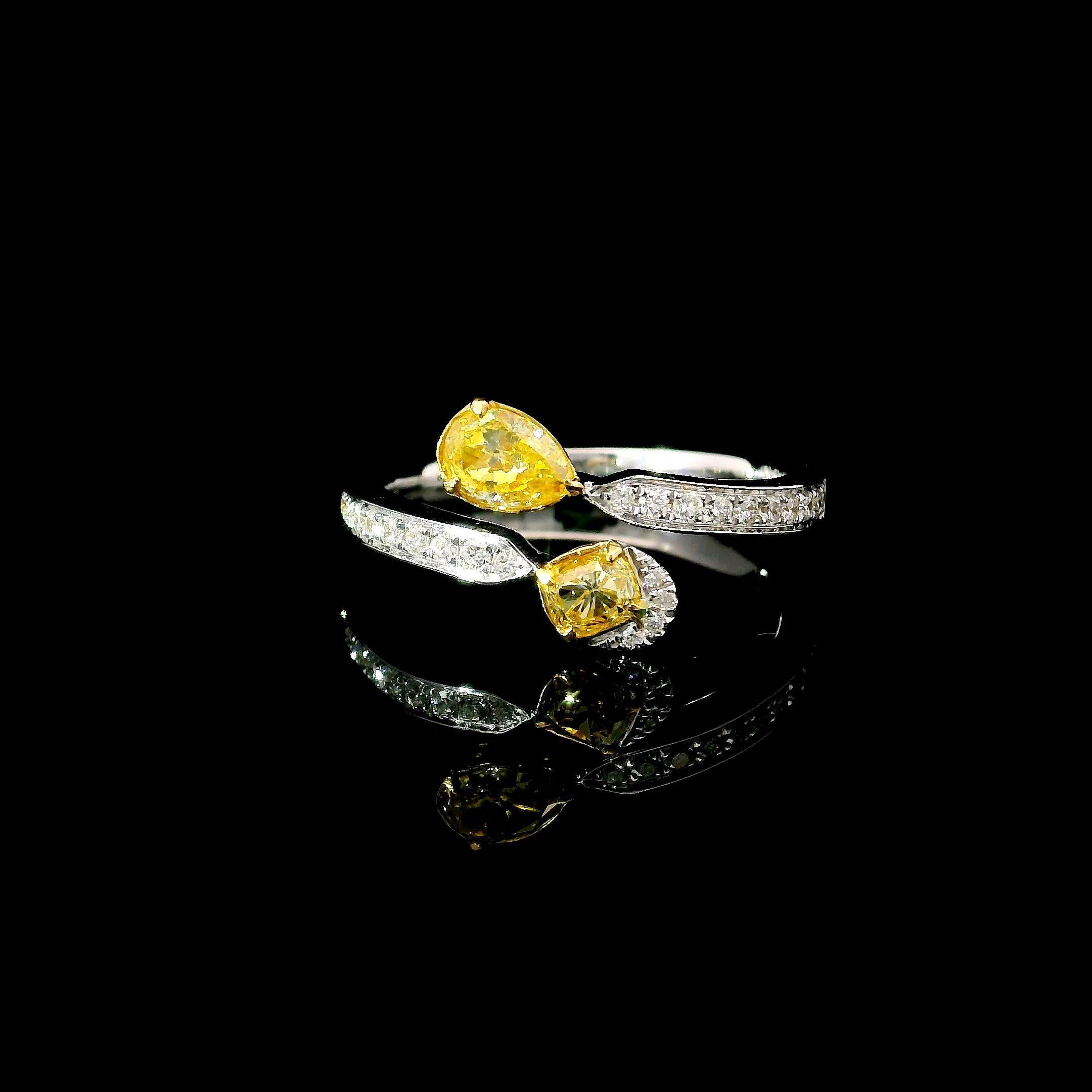 18kt white gold ring with diamonds
  
  Gold colour & karat: White gold 18kt
  Weight: 3.08 grams
  
  Set with-
  Stone; Pear / Cushion
  Carat: 0.324 / 0.226
  Colour: Fancy Intense Yellow / Fancy Intence Yellow  
  Clarity: VS / VS
  
 
