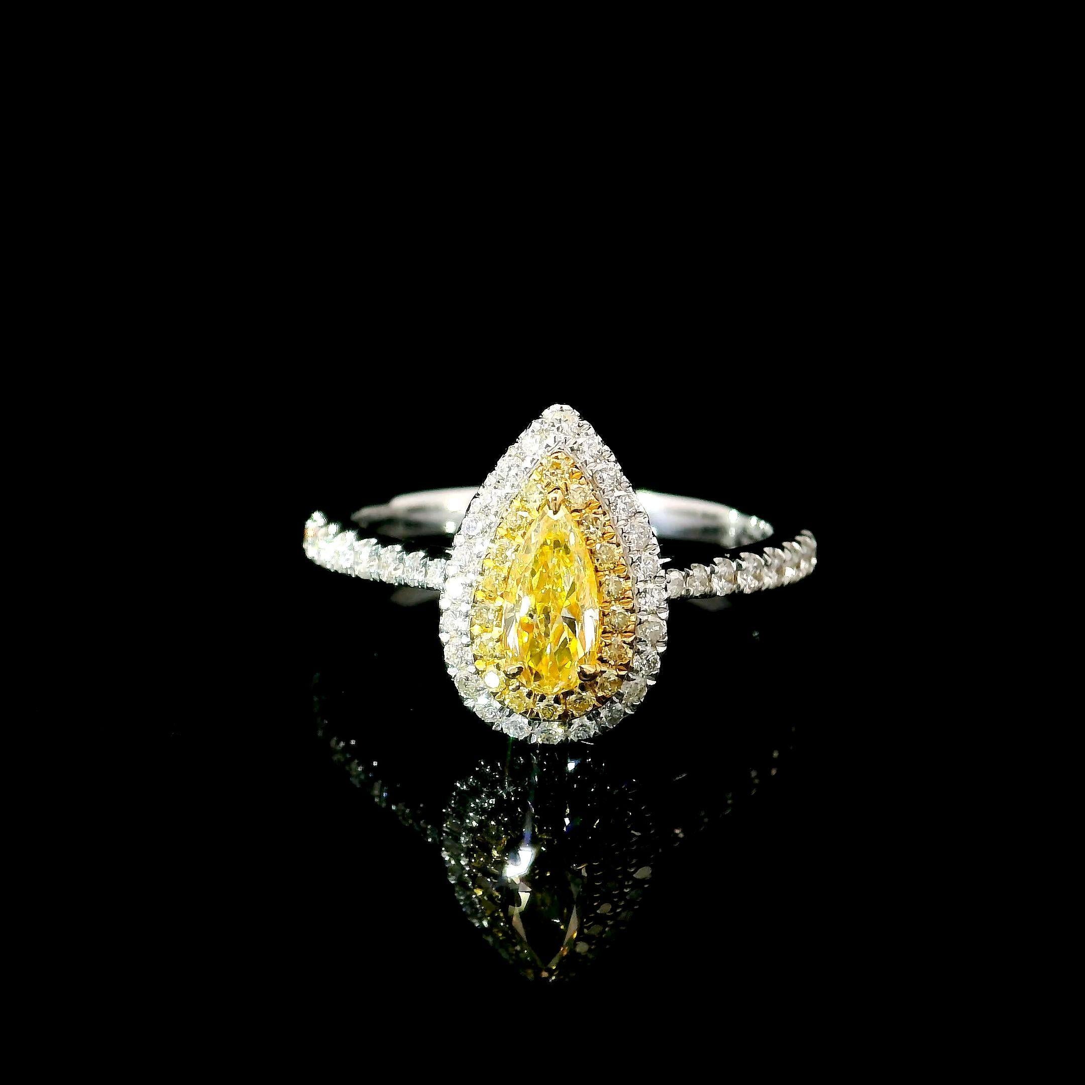 18kt white gold ring with diamonds
  
  Gold colour & karat: White gold 18kt
  Weight: 2.87 grams
  
  Set with-
  Stone type: Diamonds
  Shape: Pear
  Carat: 0.341 ct
  Colour: Fancy Yellow
  Clarity: VS
  
  Surrounding Stones: Diamonds
 1) White