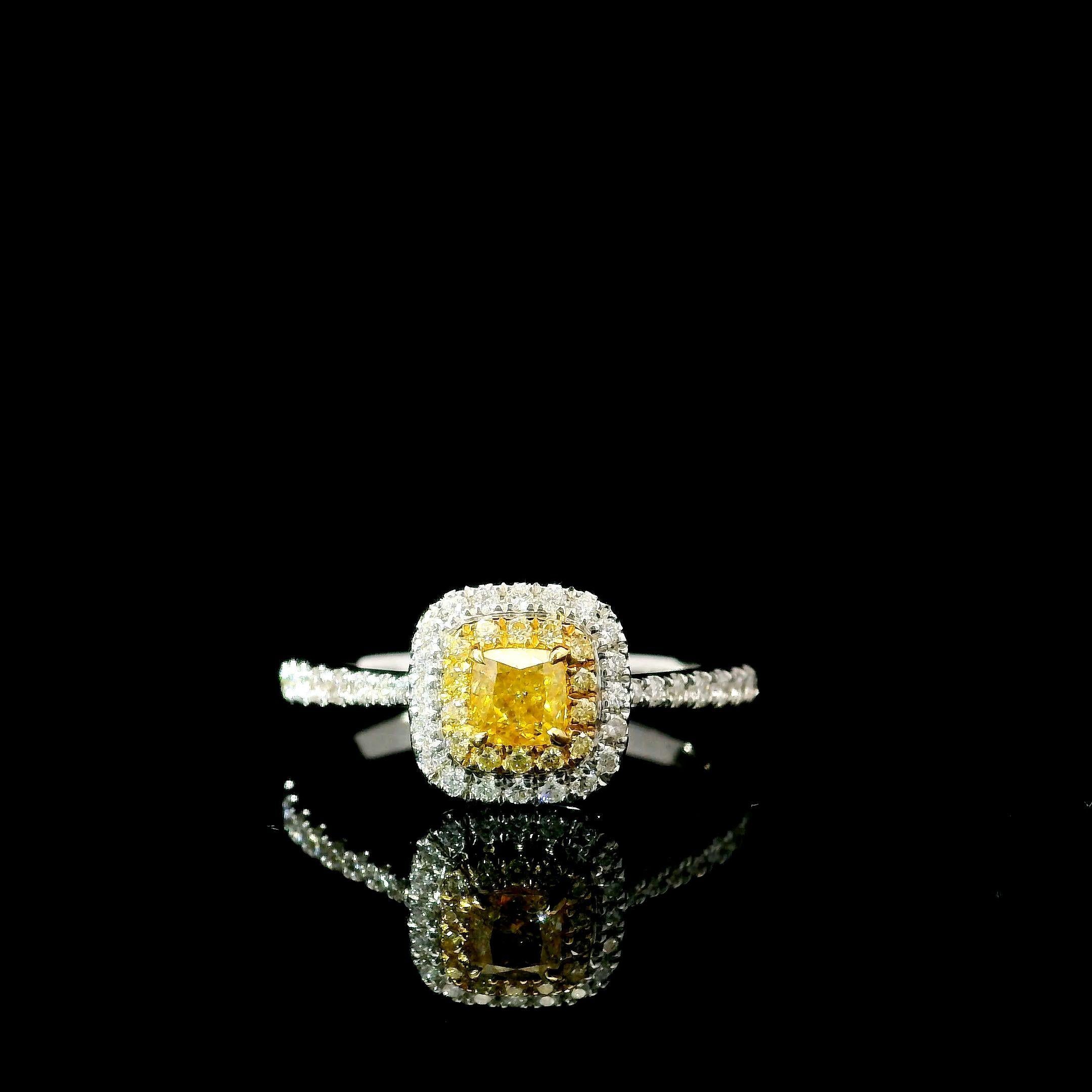 18kt white gold ring with diamonds
  
  Gold colour & karat: White gold 18kt
  Weight: 2.89 grams
  
  Set with-
  Stone type: Diamonds
  Shape: Round
  Carat: 0.344 ct
  Colour: Fancy Intense Yellow
  Clarity: VS
  
  Surrounding Stones: Diamonds
