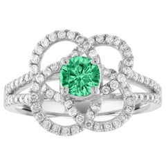 Anello con fiore in oro con diamante smeraldo certificato AGL da 0,35 carati