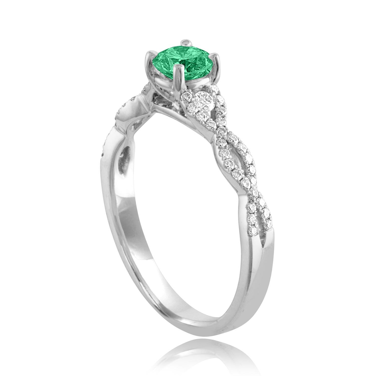 Beautiful Diamond & Emerald Infinity Ring
The ring is 18K White Gold.
There are 0.31 Carats in Diamonds F/G VS/SI
The Center is Round 0.36 Carat Emerald.
The Emerald is AGL certified.
The ring is a size 6.50, sizable.
The ring weighs 2.5 grams.