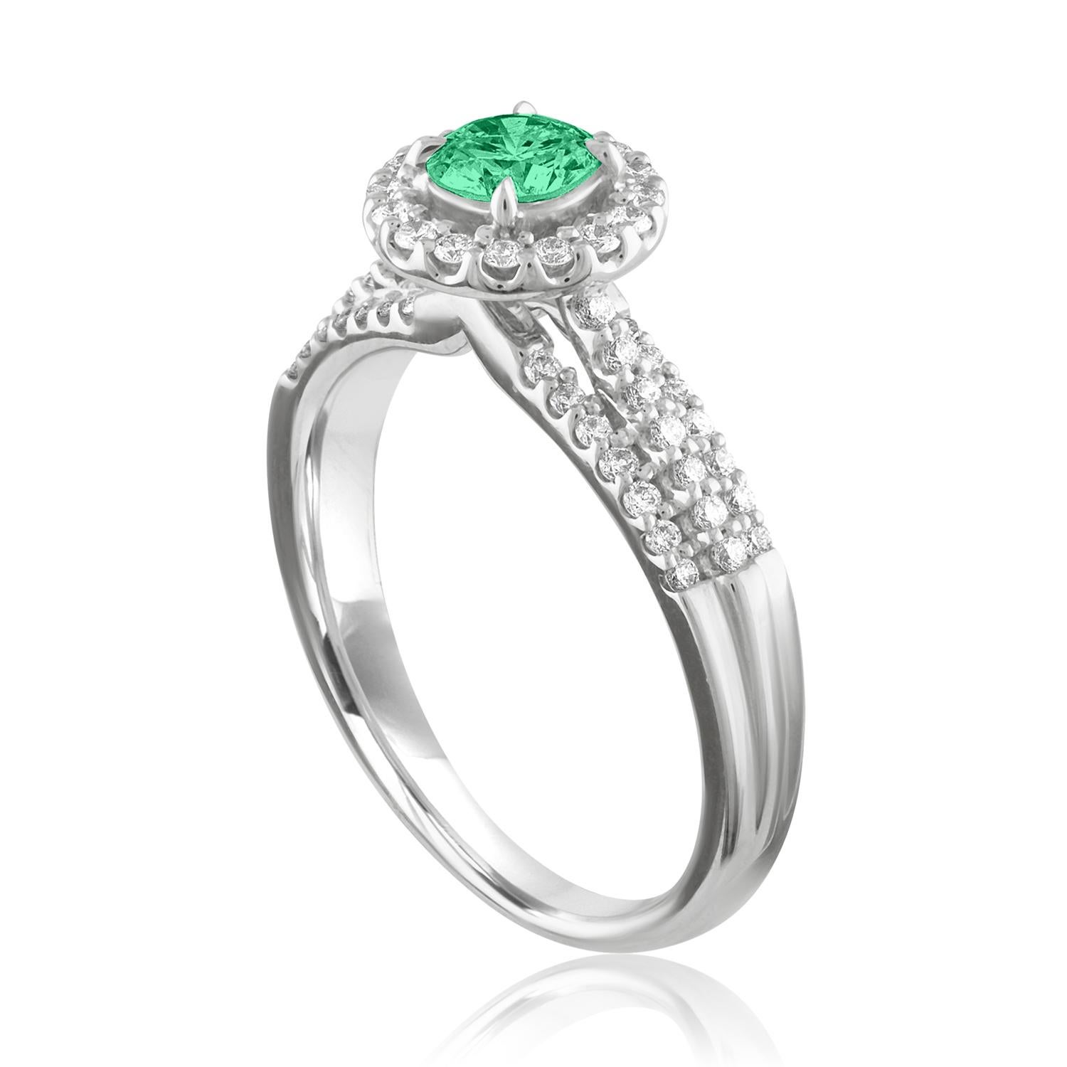 Beautiful Diamond & Emerald Halo Ring
The ring is 18K White Gold.
There are 0.35 Carats in Diamonds F/G VS/SI
The Center is Round 0.38 Carat Emerald.
The Emerald is AGL certified.
The ring is a size 6.75, sizable.
The ring weighs 4.3 grams.