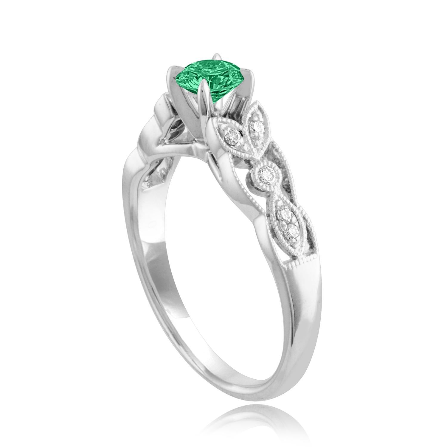 Beautiful Diamond & Emerald Milgrain Ring
The ring is 18K White Gold.
There are 0.09 Carats in Diamonds F/G VS/SI
The Center is Round 0.38 Carat Emerald.
The Emerald is AGL certified.
The ring is a size 6.75, sizable.
The ring weighs 3.8 grams.