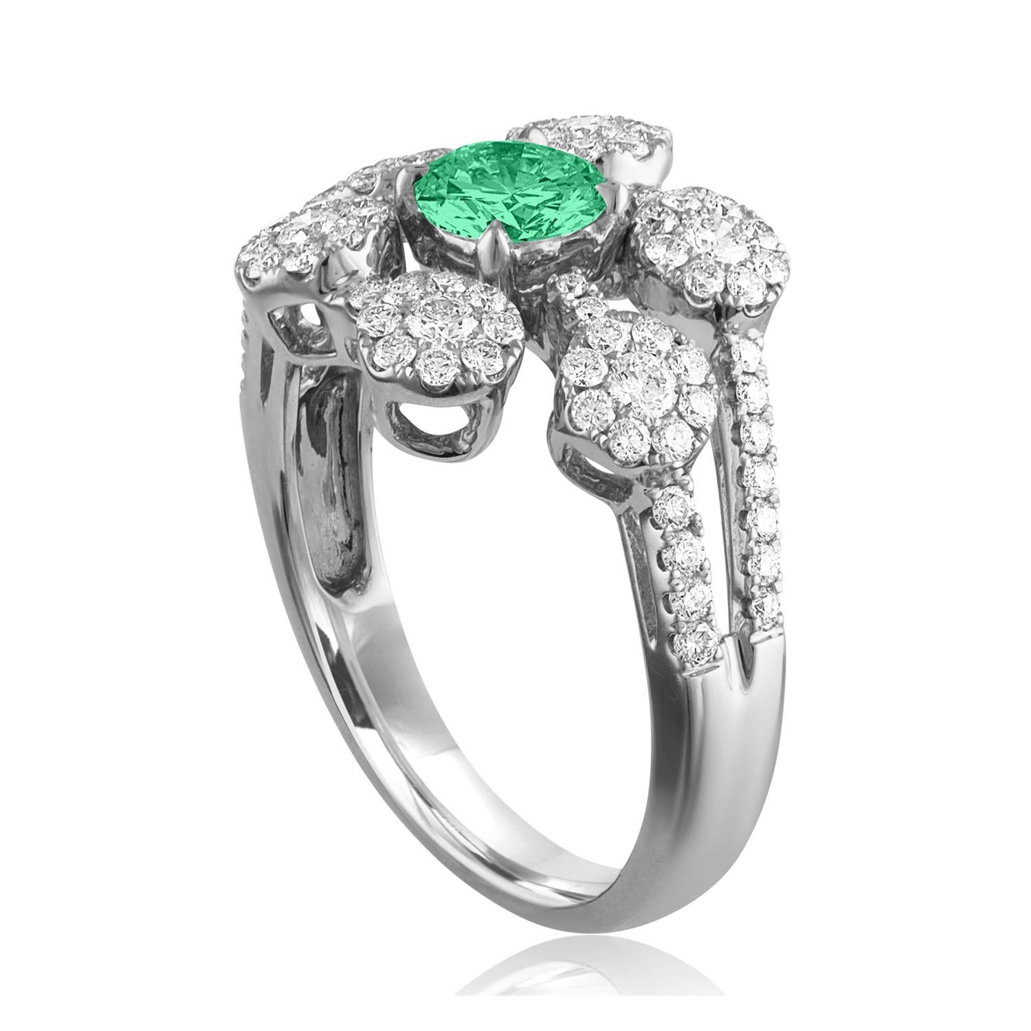 Beautiful Diamond & Emerald Flower Ring
The ring is 18K White Gold.
There are 0.73 Carats in Diamonds F/G VS/SI
The Center is Round 0.40 Carat Emerald.
The Emerald is AGL certified.
The ring is a size 6.50, sizable.
The ring weighs 5.2 grams.