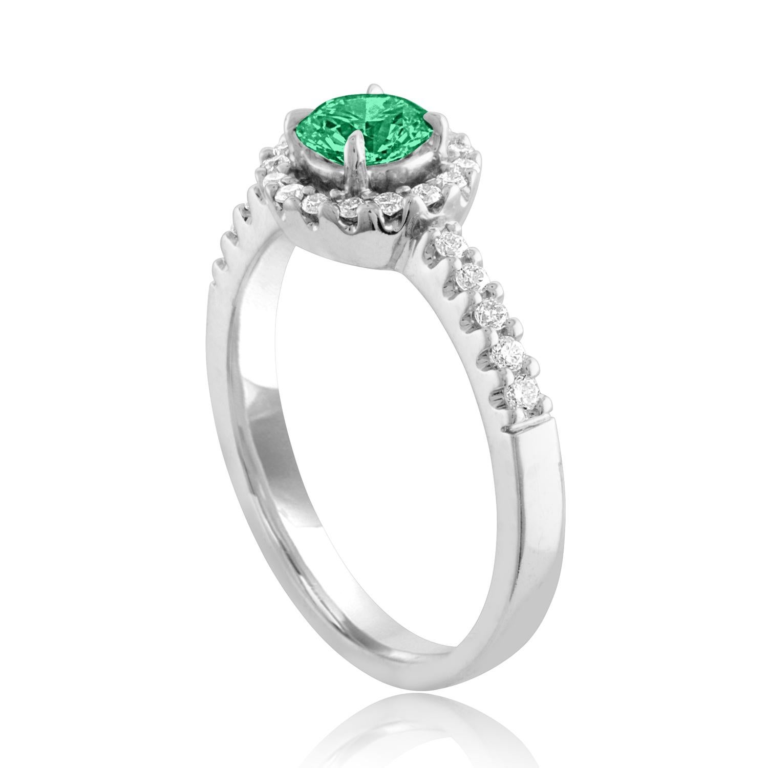 Beautiful Diamond & Emerald Halo Ring
The ring is 18K White Gold.
There are 0.22 Carats in Diamonds F/G VS/SI
The Center is Round 0.40 Carat Emerald.
The Emerald is AGL certified.
The ring is a size 6.25, sizable.
The ring weighs 3.8 grams.