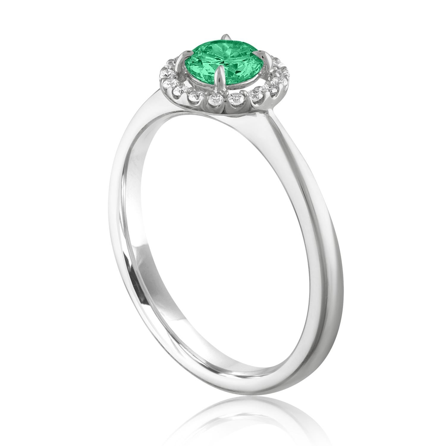 Beautiful Diamond & Emerald Halo Ring
The ring is 18K White Gold.
There are 0.12 Carats in Diamonds F/G VS/SI
The Center is Round 0.41 Carat Emerald.
The Emerald is AGL certified.
The ring is a size 6.00, sizable.
The ring weighs 2.8 grams.