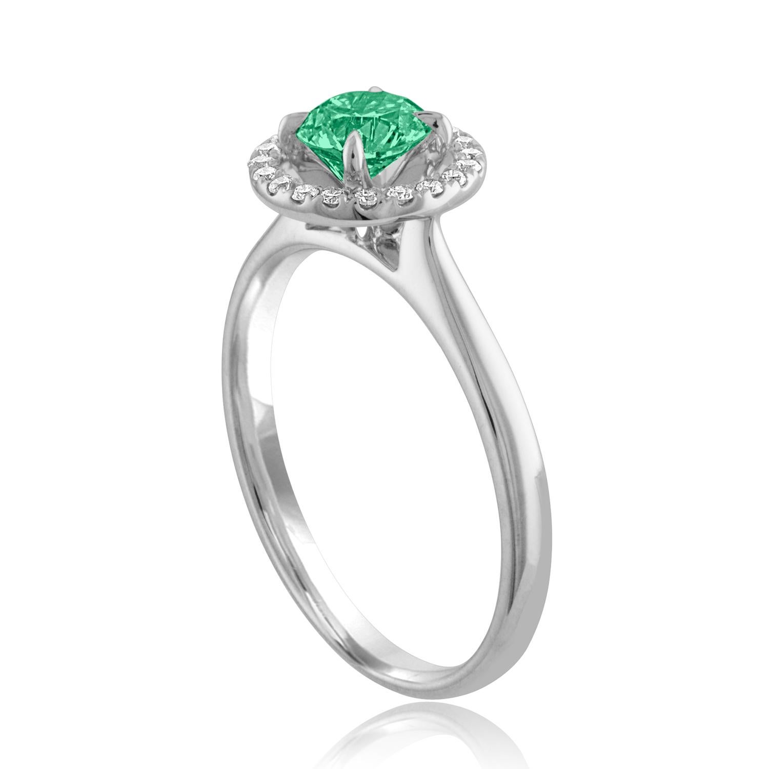 Beautiful Diamond & Emerald Halo Ring
The ring is 18K White Gold.
There are 0.15 Carats in Diamonds F/G VS/SI
The Center is Round 0.42 Carat Emerald.
The Emerald is AGL certified.
The ring is a size 7.00, sizable.
The ring weighs 2.9 grams.