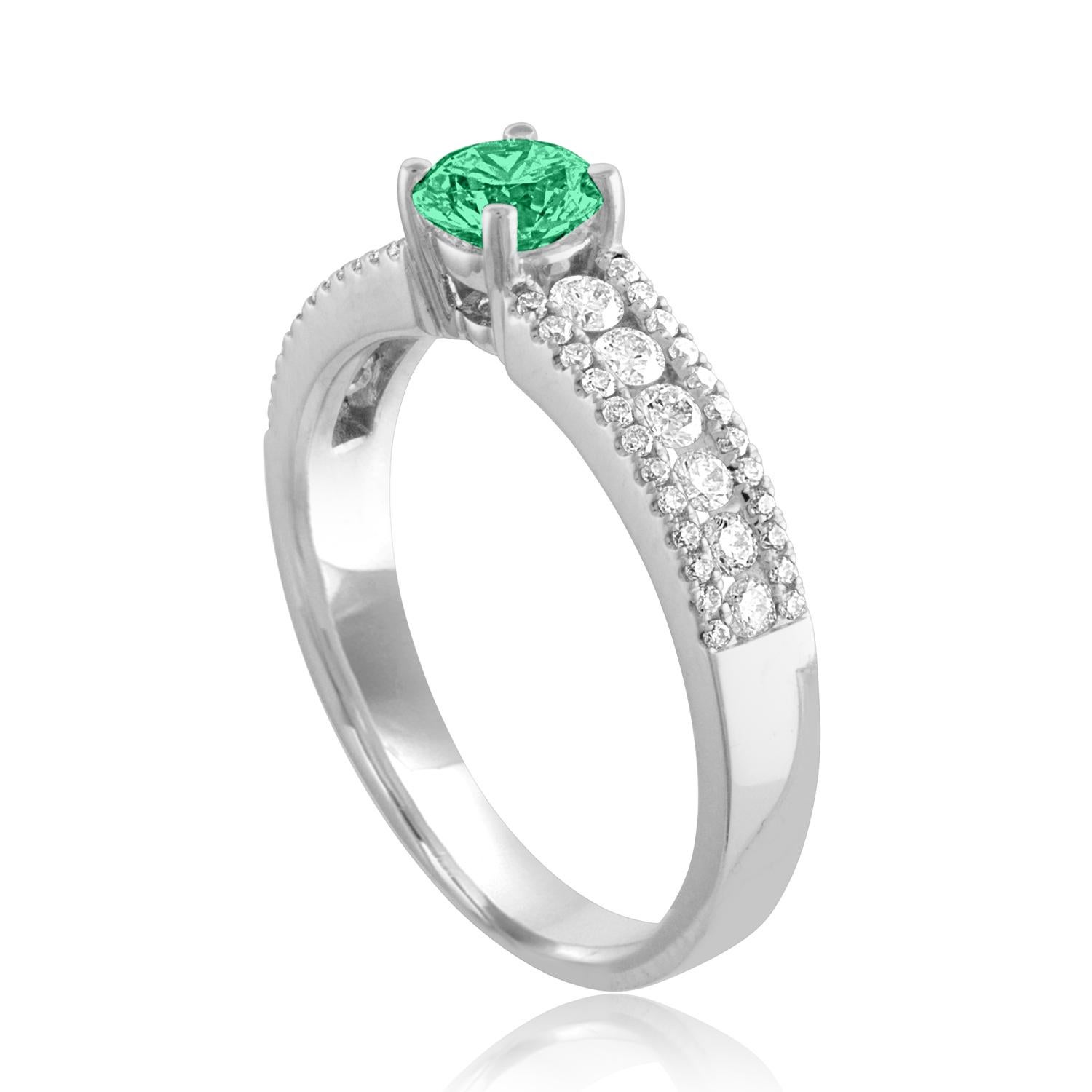 Beautiful Diamond & Emerald Ring
The ring is 18K White Gold.
There are 0.51 Carats in Diamonds F/G VS/SI
The Center is Round 0.44 Carat Emerald.
The Emerald is AGL certified.
The ring is a size 6.50, sizable.
The ring weighs 3.8 grams.