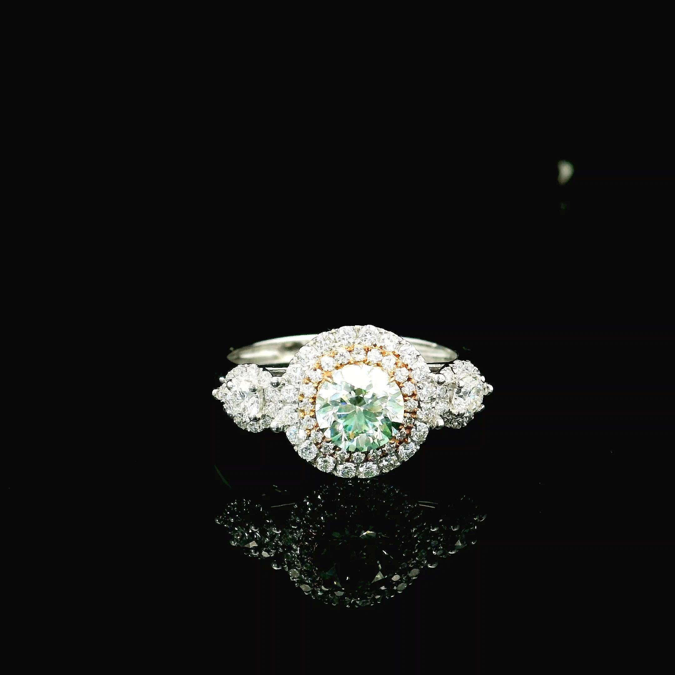 18kt white gold ring with diamonds
  
  Gold colour & karat: White gold 18kt
  Weight: 4.05 grams
  
  Set with-
  Stone type: Diamonds
  Shape: Round
  Carat: 0.46
  Colour: Fancy Green
  Clarity: SI
  
  Surrounding Stones: Diamonds
 1) White