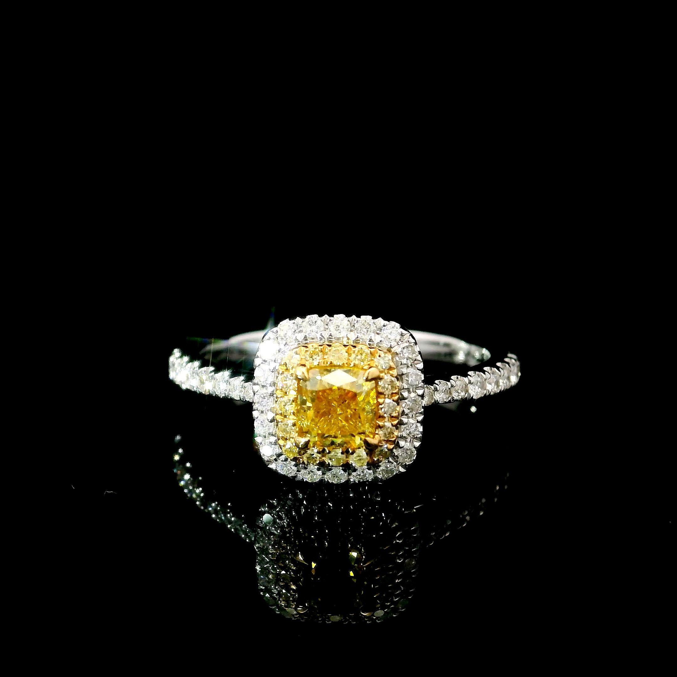 18kt white gold ring with diamonds

  Gold colour & karat: White gold 18kt
  Weight: 2.87 grams
  
  Set with-
  Stone type: Diamonds
  Shape: Cushion
  Carat: 0.51 ct
  Colour: Fancy Intense Yellow
  Clarity: VS
  
  Surrounding Stones: Diamonds
