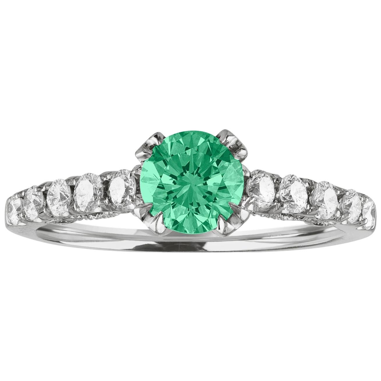 Beautiful Diamond & Emerald Milgrain Ring
The ring is 18K White Gold.
There are 0.55 Carats in Diamonds F/G VS/SI
The Center is Round 0.52 Carat Emerald.
The Emerald is AGL certified.
The ring is a size 6.50, sizable.
The ring weighs 2.8 grams.