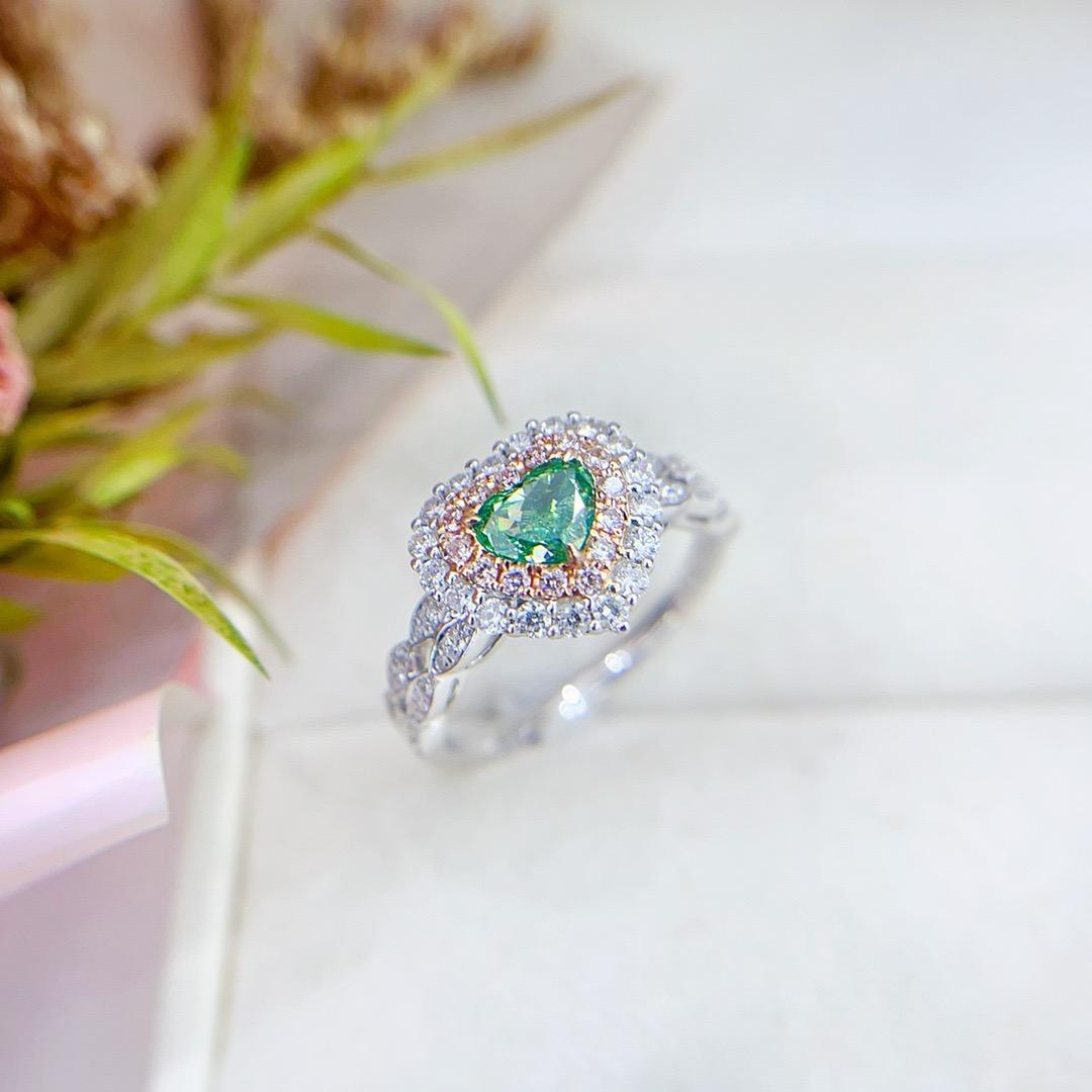 AGL Certified 0.52 CT Green Diamond 18K White Gold Ring with Diamonds

1 Green Diamond - 0.52 CT
AGL Certification
Hear-Cut

Diamonds - 0.45 CT
Total Weight - 3.41 GM