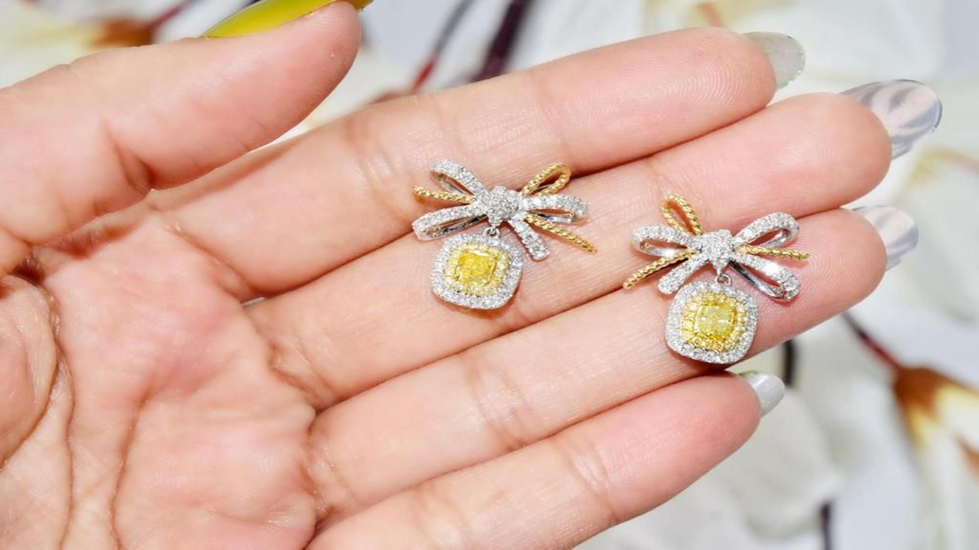 Cushion Cut AGL Certified 0.752 Carat Fancy Yellow SI Clarity Diamond Earrings For Sale
