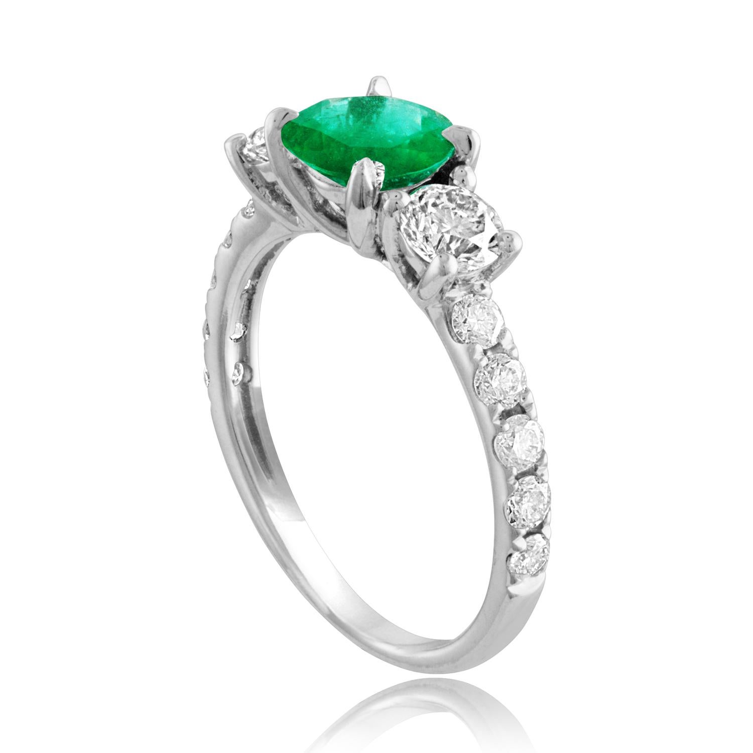 Beautiful 3 Stone Emerald Ring
The ring is 18K White Gold.
The Center is a beautiful Round 0.77 Carat Emerald.
The Emerald is AGL certified.
There are 2 side stones and small diamonds 0.92 Carats Diamonds F/G VS/SI
The ring is a size 5.00,