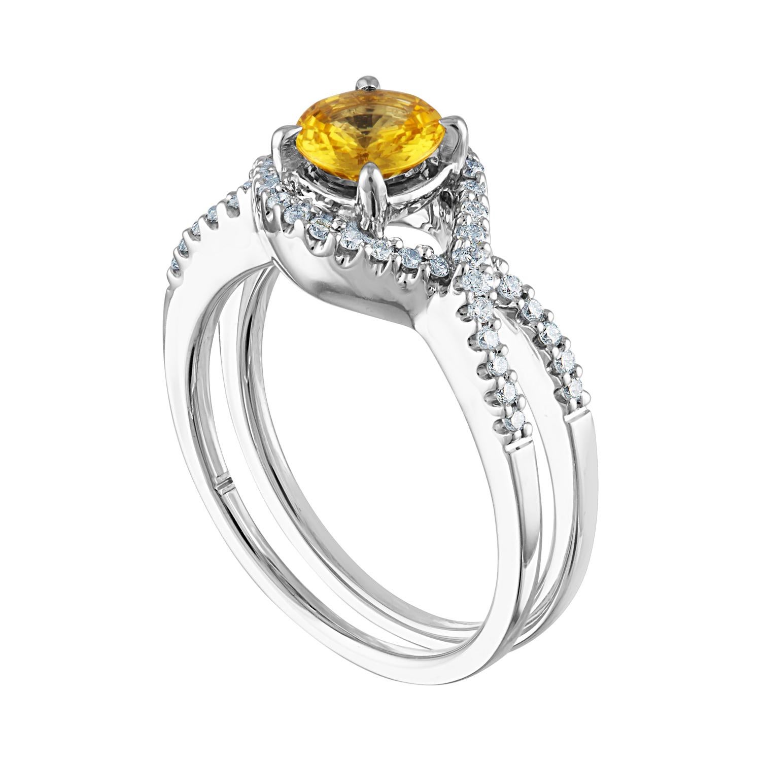Beautiful Twist Shank Ring
The ring is 18K White Gold
The Center Stone is a Round Yellow Sapphire 0.77 Carats
The Sapphire is AGL Certified Heated
There are 0.36 Carats in Diamonds F/G VS/SI
The ring is a size 6.00, sizable.
The ring weighs 5.3 grams