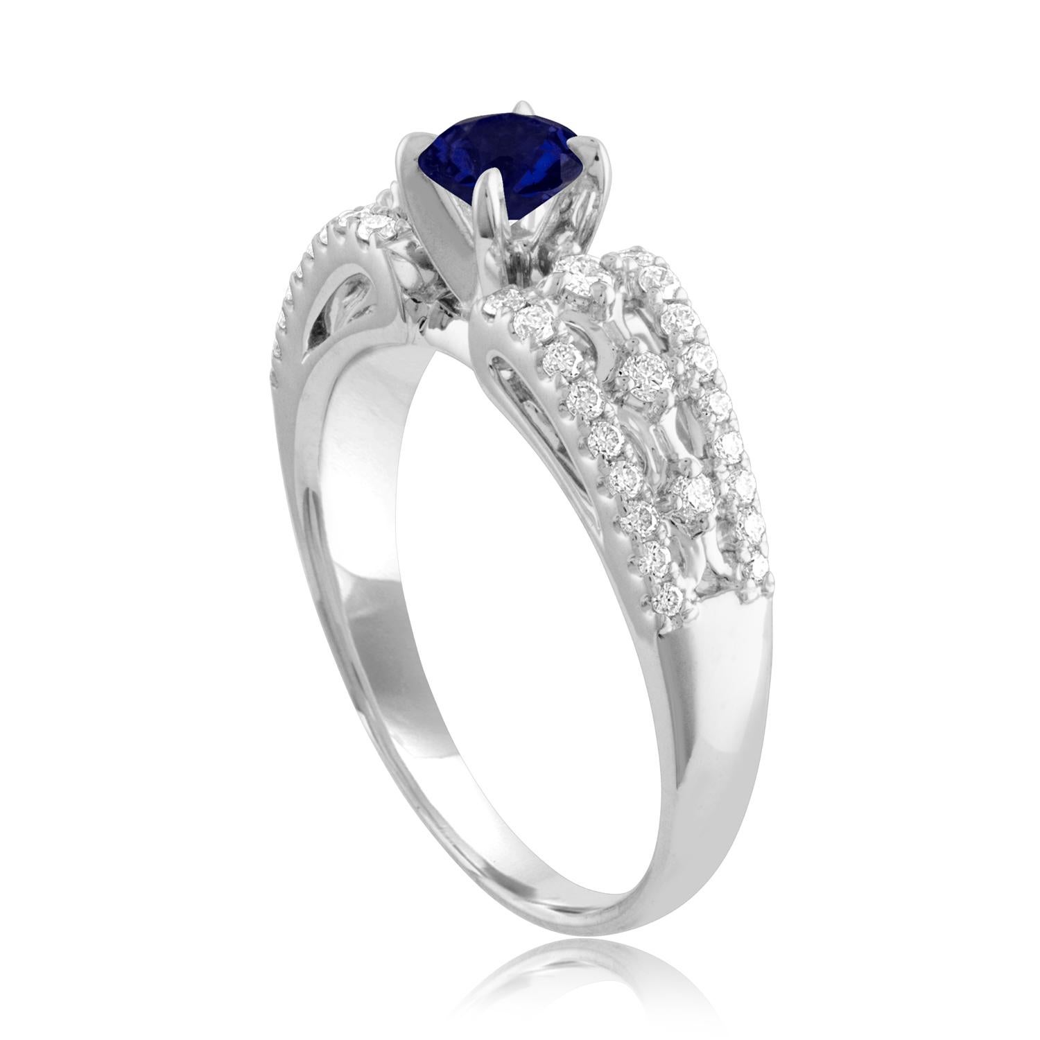 Beautiful Sapphire Ring
The ring is 18K White Gold
The Center Stone is a Round Blue Sapphire 0.80 Carats
The Sapphire is AGL Certified Heated
There are 0.33 Carats in Diamonds F/G VS/SI
The ring is a size 6.75, sizable
The ring weighs 4.8 grams