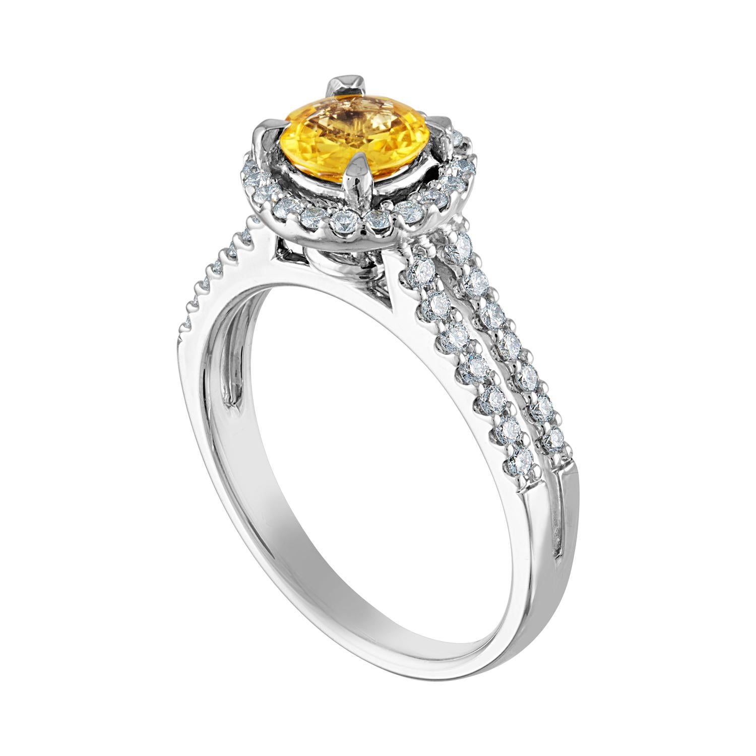 Beautiful Halo Ring
The ring is 18K White Gold
The Center Stone is a Round Yellow Sapphire 0.84 Carats
The Sapphire is AGL Certified Heated
There are 0.41 Carats in Diamonds F/G VS/SI
The ring is a size 6.5, sizable.
The ring weighs 5.3 grams