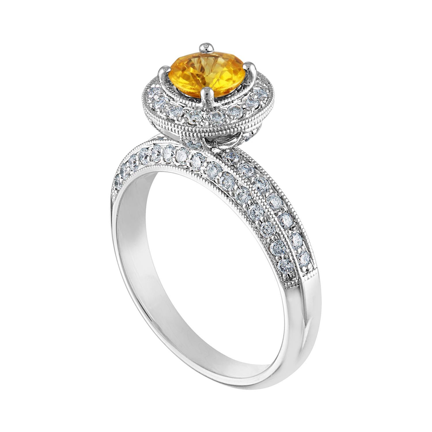 Beautiful Art Deco Revival Round Halo Milgrain Ring
The ring is 14K White Gold
The Center Stone is a Round Yellow Sapphire 0.86 Carats
The Sapphire is AGL Certified Heated
There are 0.85 Carats in Diamonds F/G VS/SI
The ring is a size 7.00,