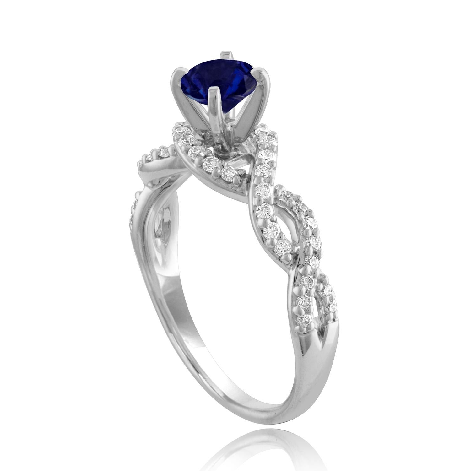 Beautiful Infinity Shank Sapphire Ring
The ring is 18K White Gold
The Center Stone is a Round Blue Sapphire 0.88 Carats
The Sapphire is AGL Certified Heated
There are 0.33 Carats in Diamonds F/G VS/SI
The ring is a size 6.75, sizable.
The ring