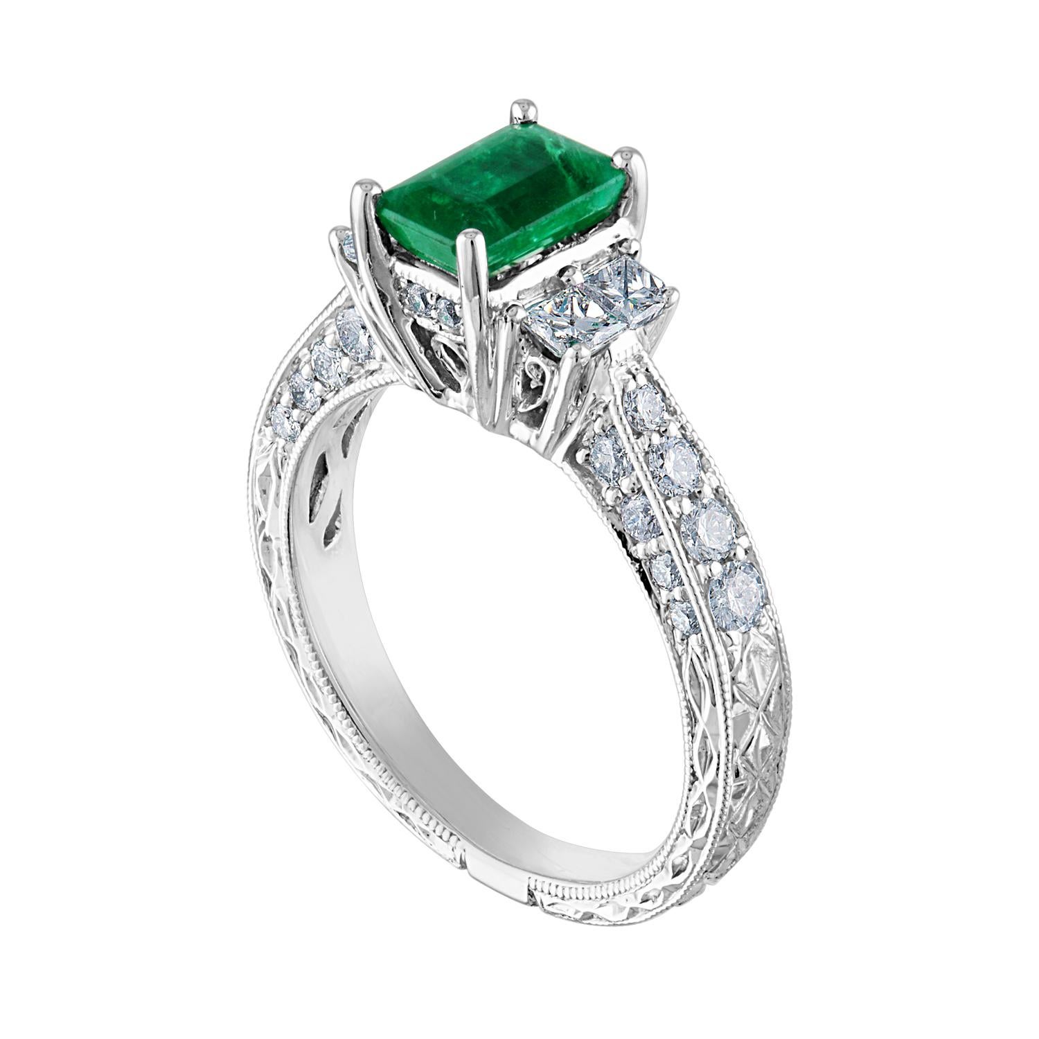 Beautifully Milgrain and Filigree Emerald Ring
The ring is 18K White Gold
The Center Stone is 0.89 Carats
The Emerald is AGL Certified
There are 1.00 Carats In Round Diamonds F/G VS/SI
The ring is a size 6.00, sizable.
The ring weighs 5.4 grams