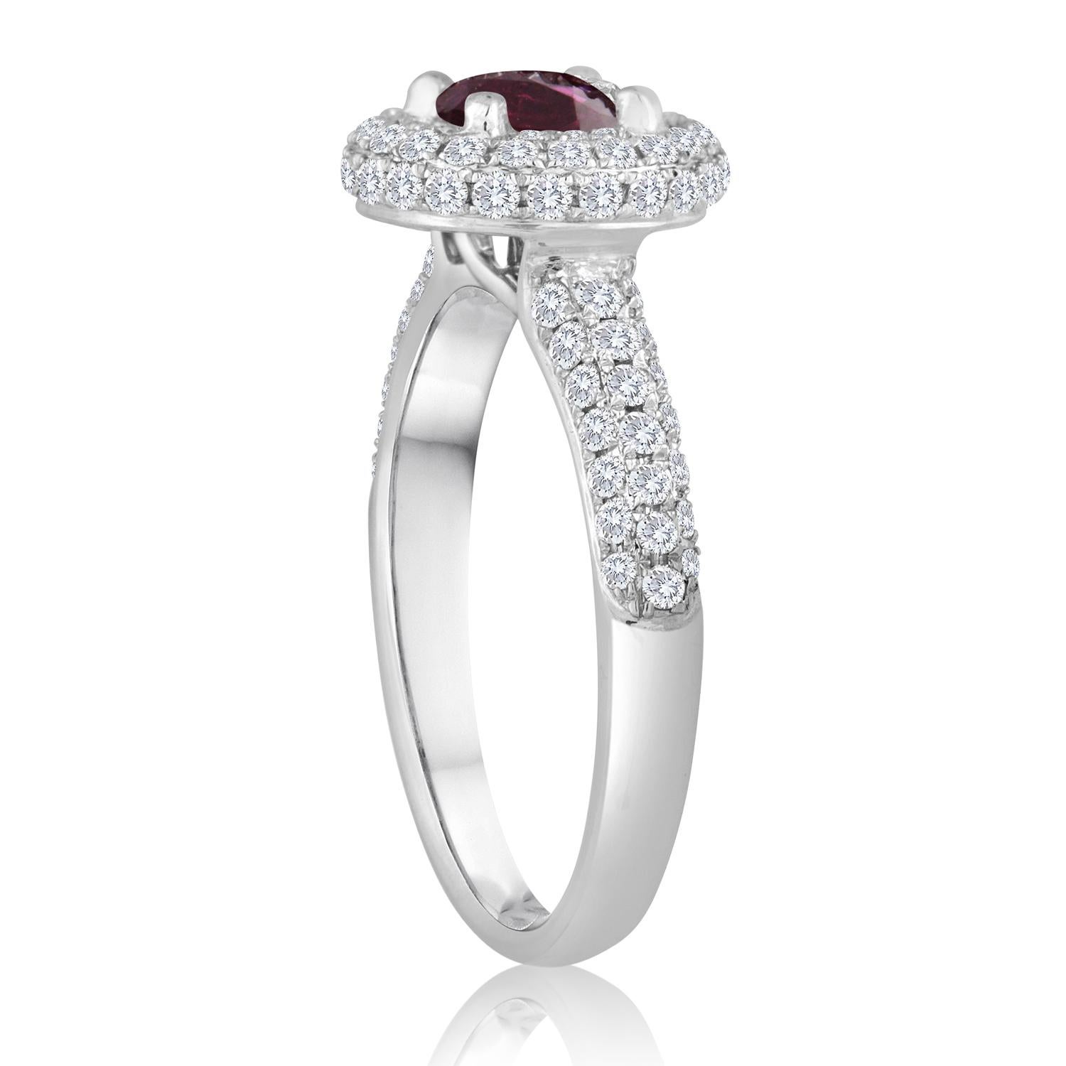 Beautiful Round Halo Pave Ring
The ring is 18K White Gold
The Center Stone is a Round Ruby 0.89 Carats
The Ruby is AGL Certified Heated
There are 0.81 Carats in Diamonds F/G VS/SI
The ring is a size 6.75, sizable 1 size up or 1 size down, max.
The