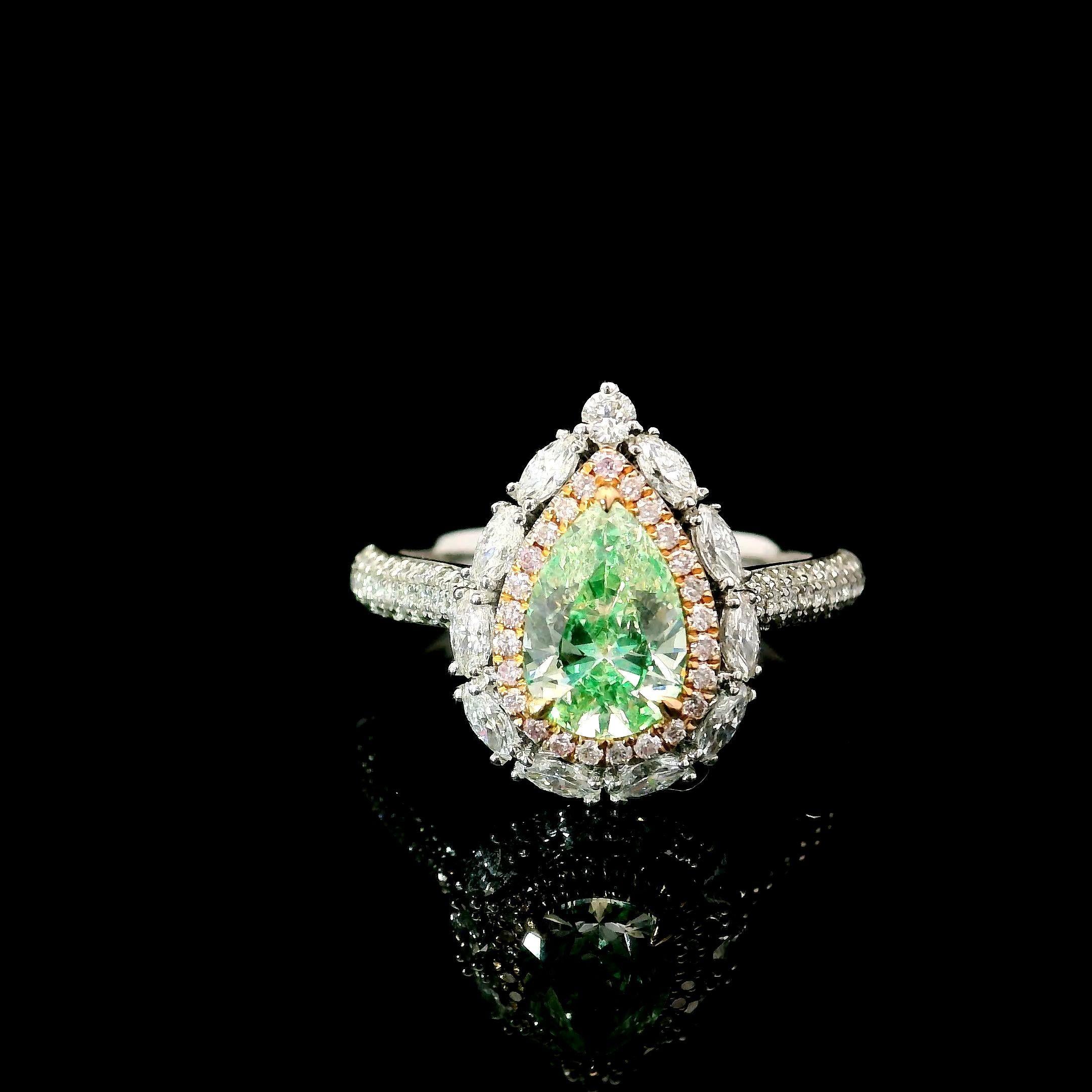 18kt white gold ring with diamonds
  
  Gold colour & karat: White gold 18kt
  Weight: 4.242 grams
  
  Set with-
  Stone type: Diamonds
  Shape: Pear
  Carat: 0.90 ct
  Colour: Fancy Green
  Clarity: VS
  
  Surrounding Stones: Diamonds
 1) White