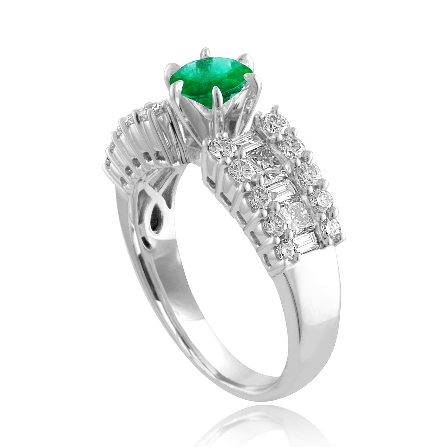 Beautiful Round Emerald Gold Ring
The ring is 18K White Gold.
The Center is a beautiful round cut 0.90 Carat Emerald.
The Emerald is AGL certified.
There are 1.65 Carats in Diamonds F/G VS/SI
The ring is a size 6.50, sizable.
The ring weighs 6.4