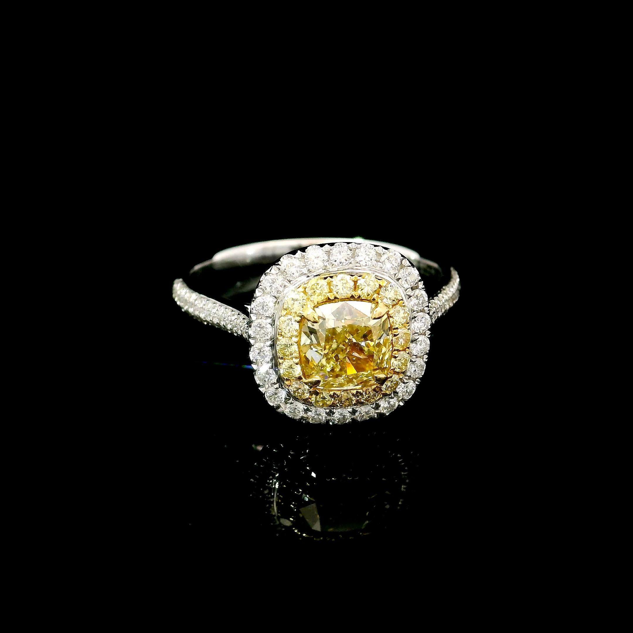 18kt white gold ring with diamonds
  
  Gold colour & karat: White gold 18kt
  Weight: 3.235 grams
  
  Set with-
  Stone type: Diamonds
  Shape: Cushion
  Carat: 0.92 ct
  Colour: Fancy Yellow
  Clarity: VS
  
  Surrounding Stones: Diamonds
 1)