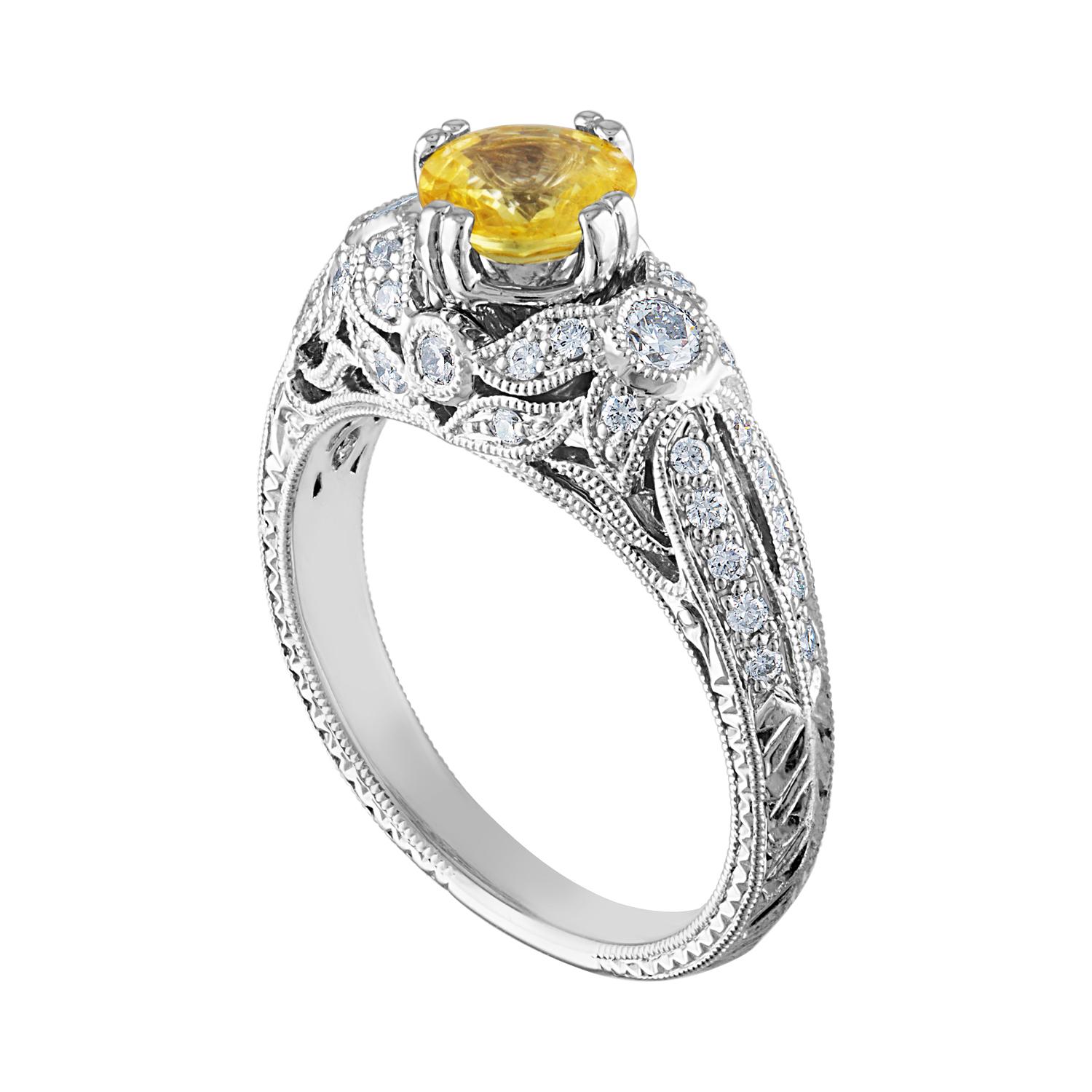 Beautiful Art Deco Revival Round Milgrain Filigree Ring
The ring is 18K White Gold
The Center Stone is a Round Yellow Sapphire 0.97 Carats
The Sapphire is AGL Certified Heated
There are 0.45 Carats in Diamonds F/G VS/SI
The ring is a size 6.75,
